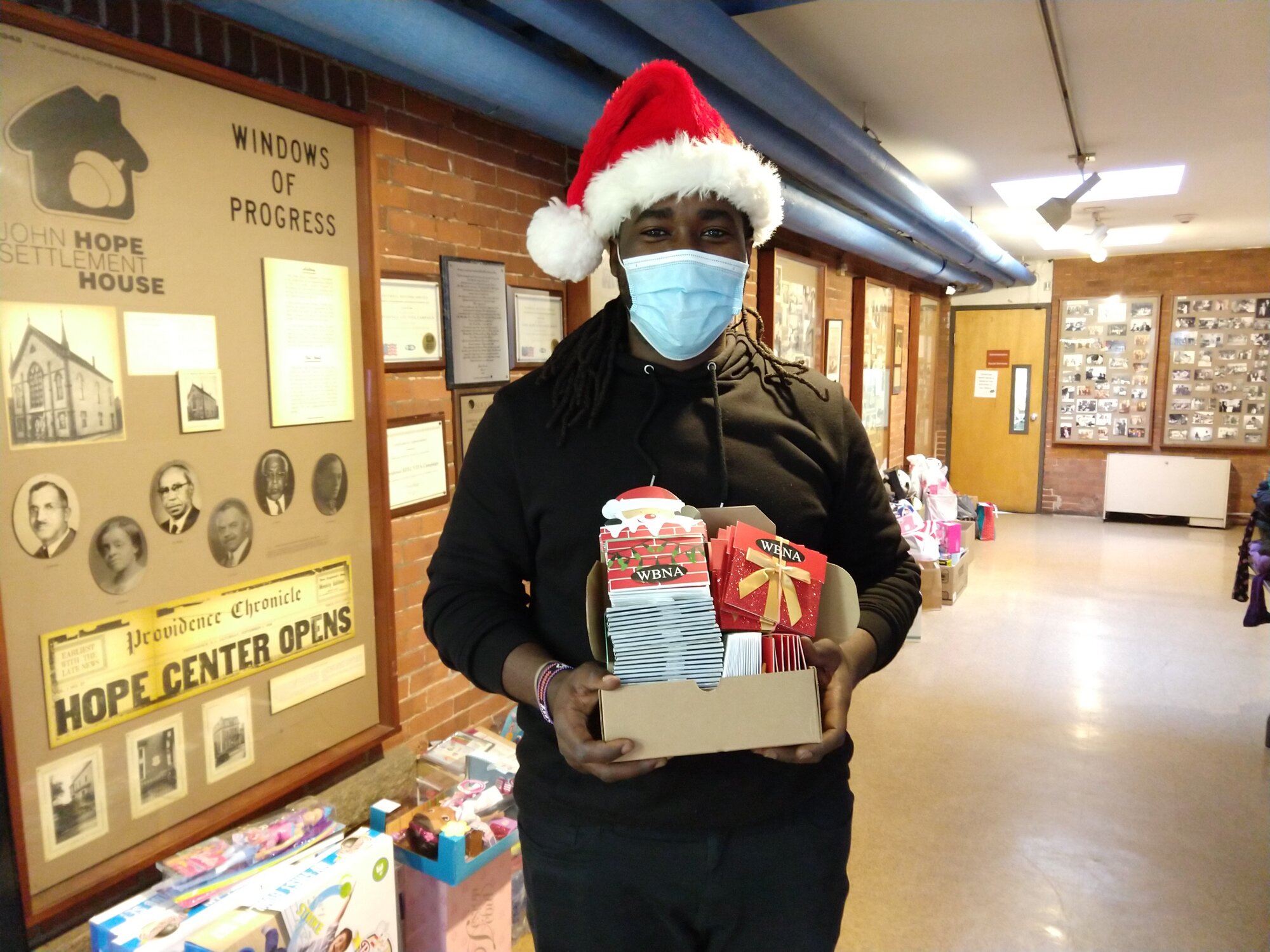  Brandford Davis, Executive Director of John Hope Settlement House, holds Amazon and grocery gift cards that were distributed to JHSH families 