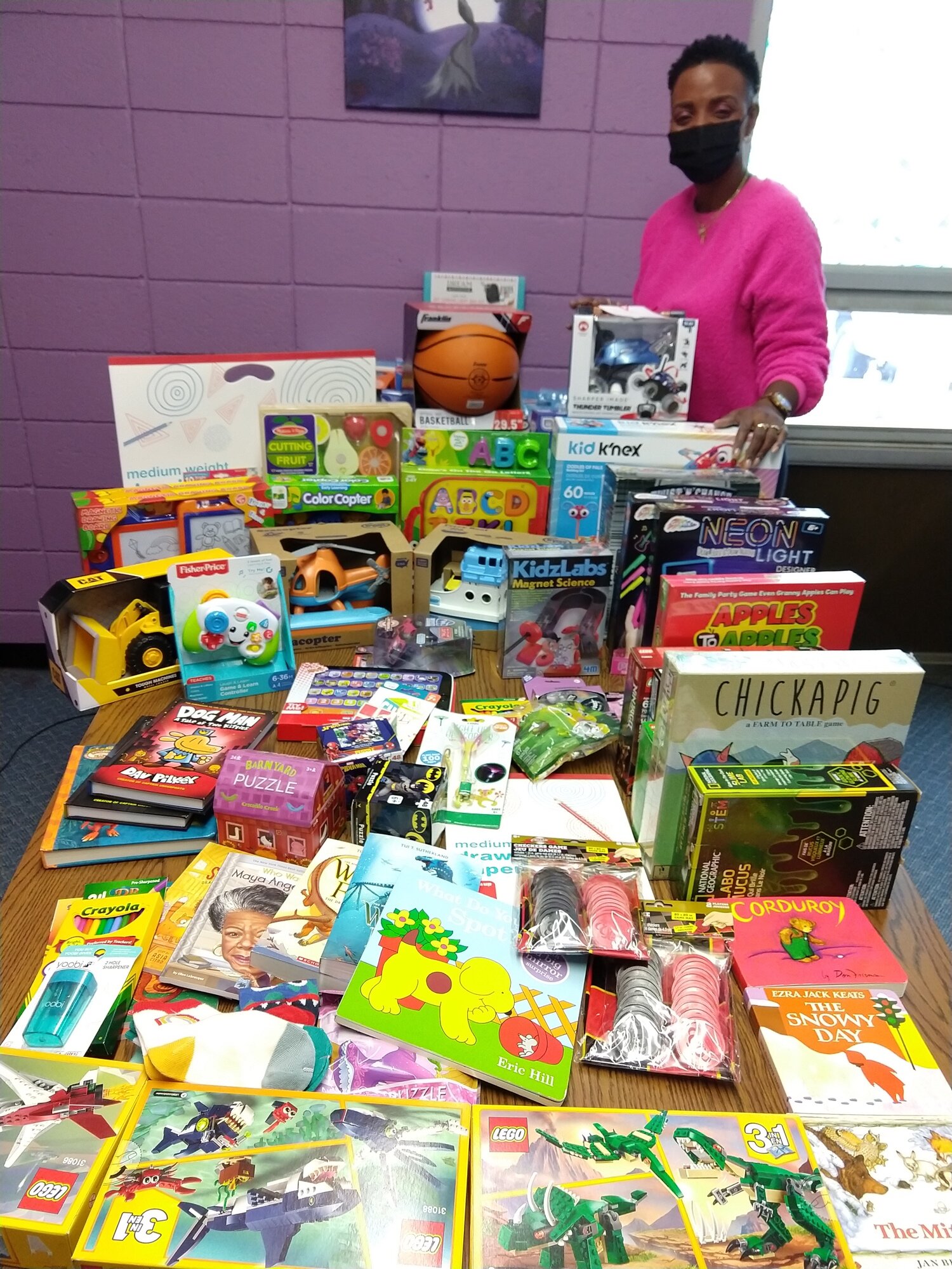  Jennifer Bandy, Education Director at West End Community Center, with educational toys donated by neighbors and our friends at All Saints Memorial Church, along with Amazon &amp; grocery gift cards 