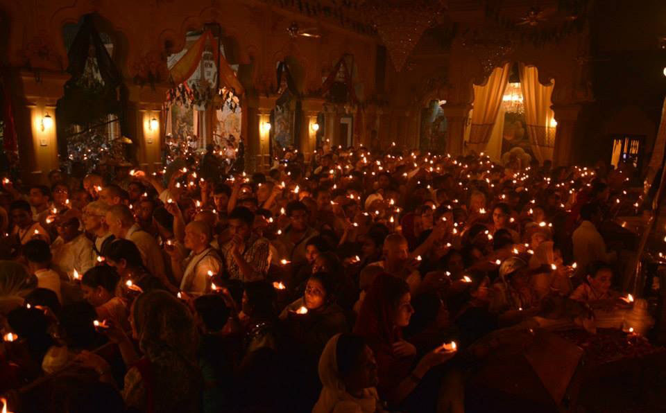 Pilgrims offering lamps in a temple in Vrindavan