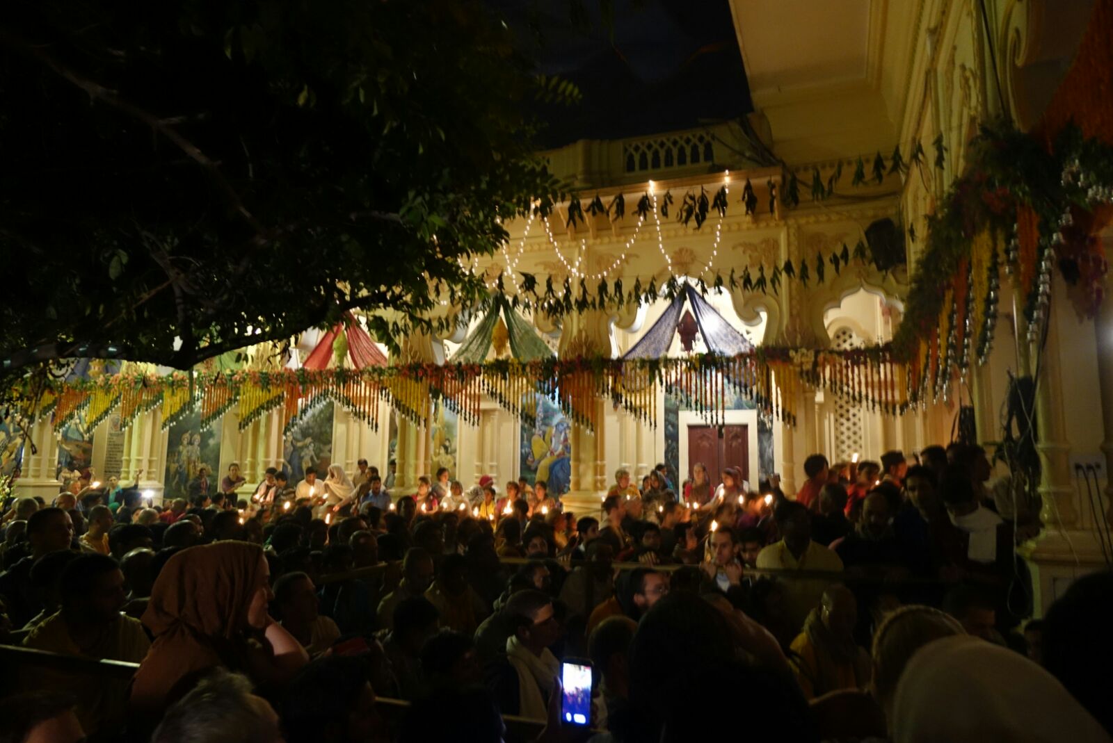 Thousands of people offering lamps in a temple in Vrindavan