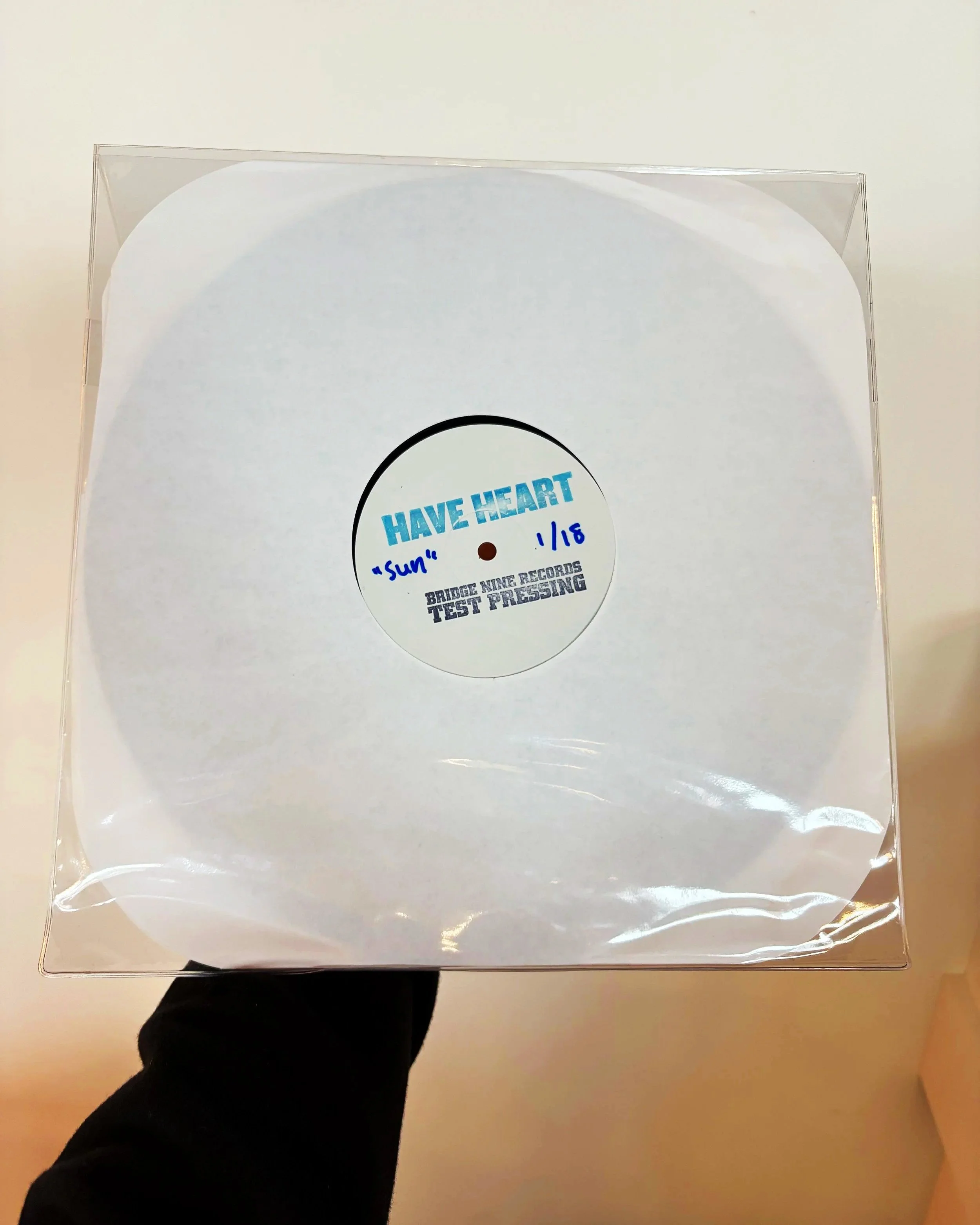 test pressing for boston hardcore band have heart's 2008 release Songs To Scream At The Sun. No album cover, just the record in a clear case where you can read handwritten notes about the album.