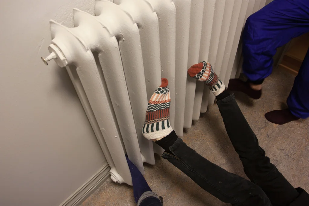 Warming our frozen feet after a walk by the Bland River. Photo by Katie Ford .