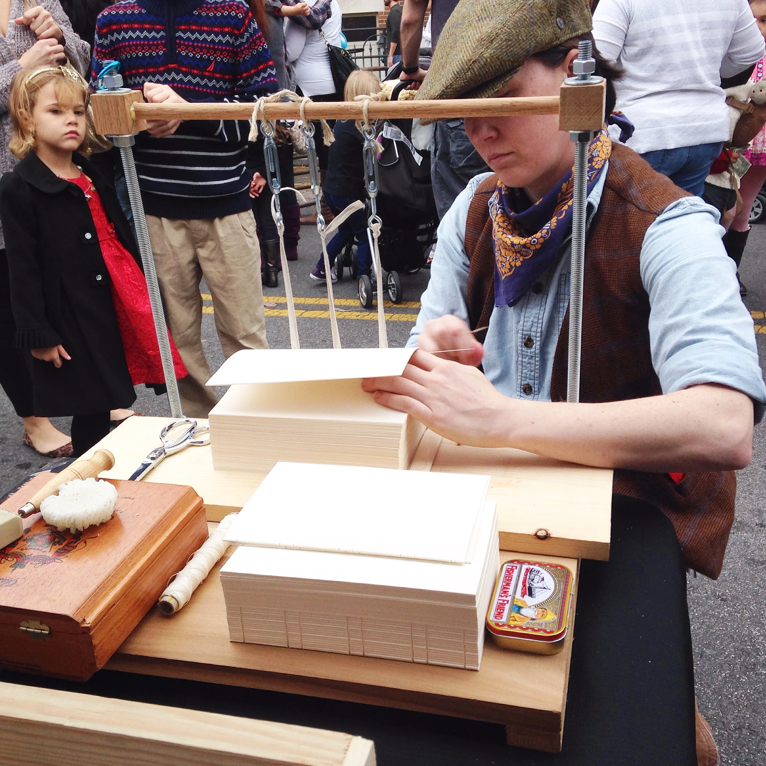 Come watch me bind books the old fashioned way, with a needle, thread, and a little elbow grease! 
