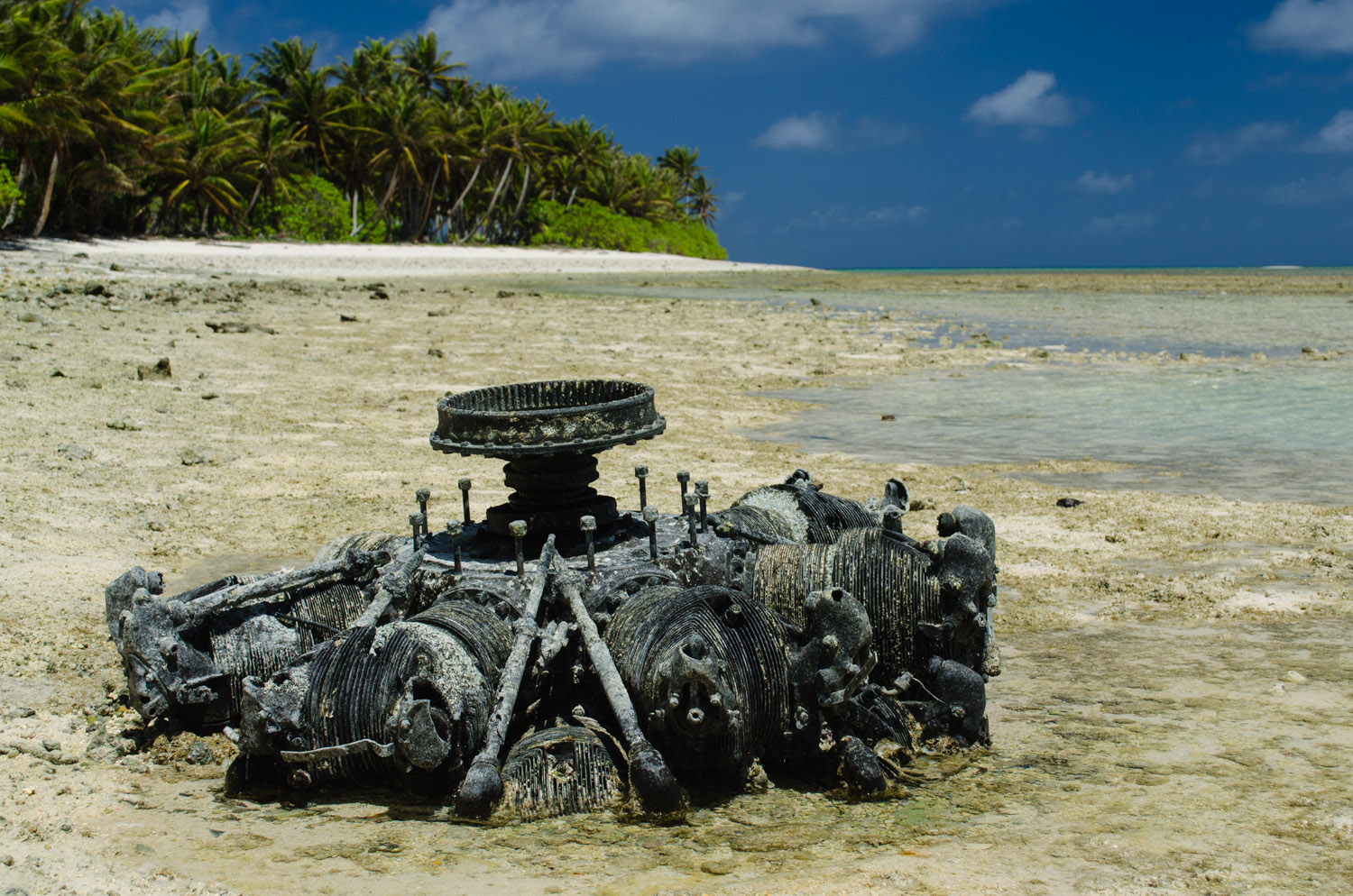 An airplane engine lies in the tidal flats beside the Taroa Island, the most easterly Japanese airfield base during World War II