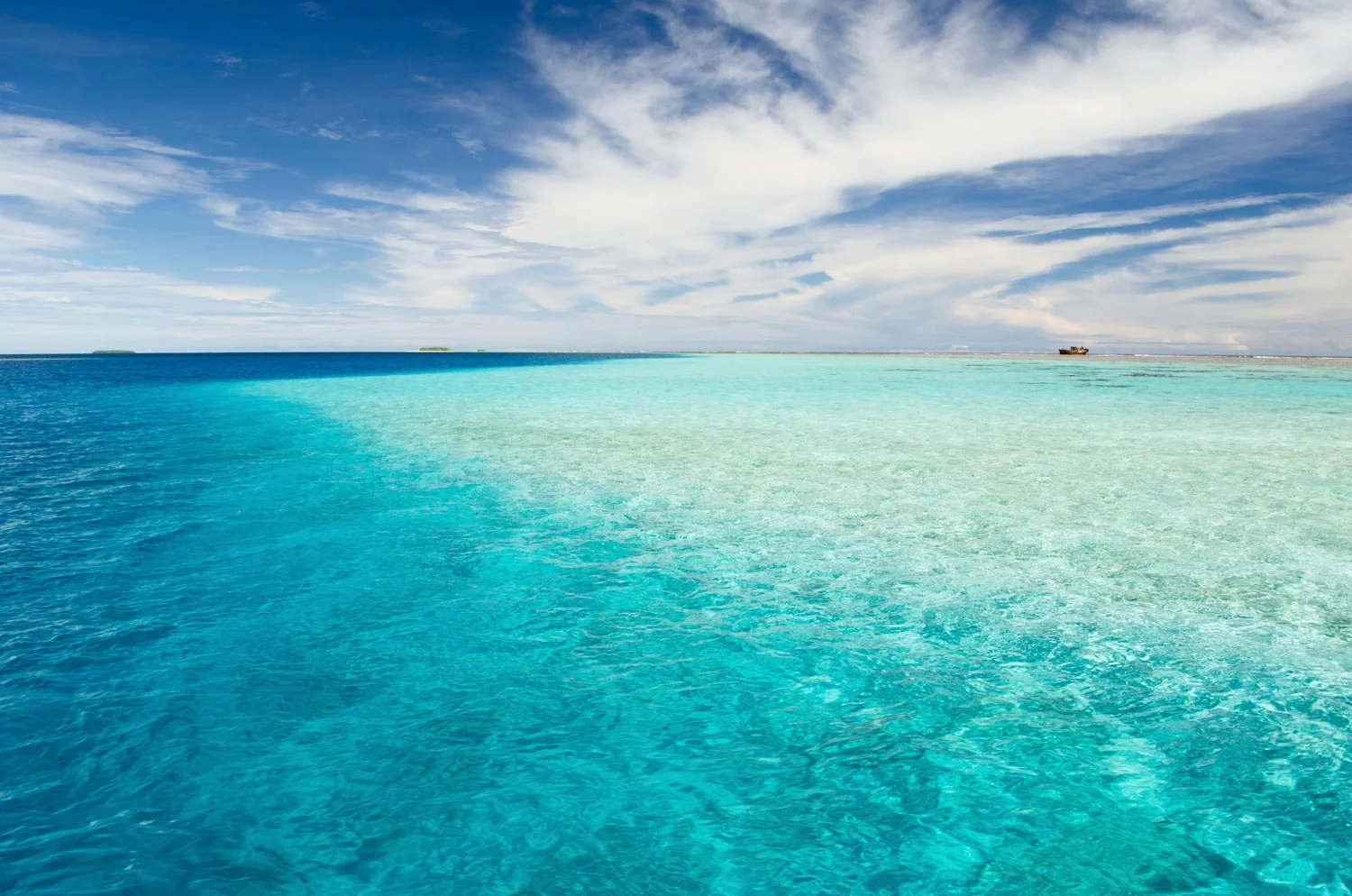 The rusting carcass of the shipwreck pierces the flat horizon of an uninhabited atoll in the remote Marshall Islands. &nbsp;Harboring distant memories of past occupants it offers an enticing mystery to those audacious enough to discover and explore …