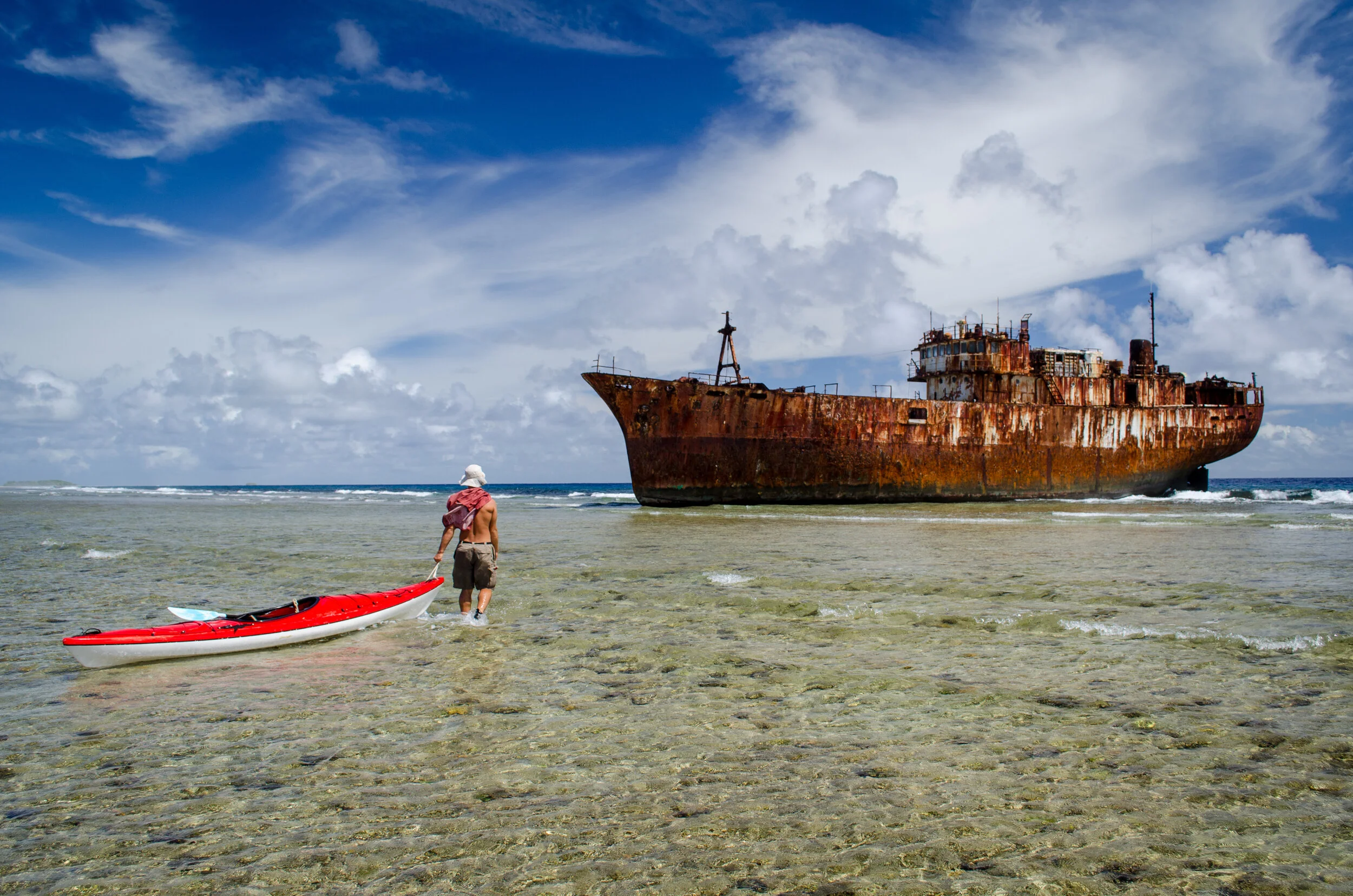 Exploring a shipwrecked fishing vessel in the Marshall Islands. Photo by Michael Chahley.