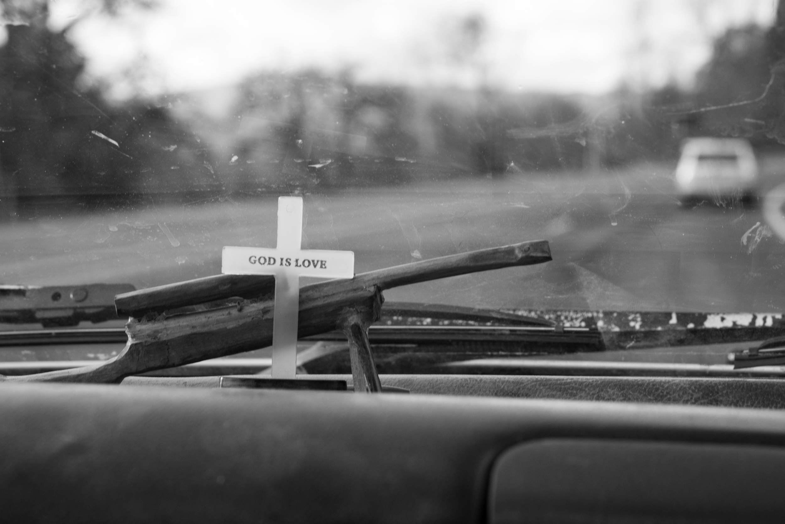  Staley's dashboard décor is a memory of a friend and a reminder of his faith. Through economic hardships, reminders like this keep him centered. 