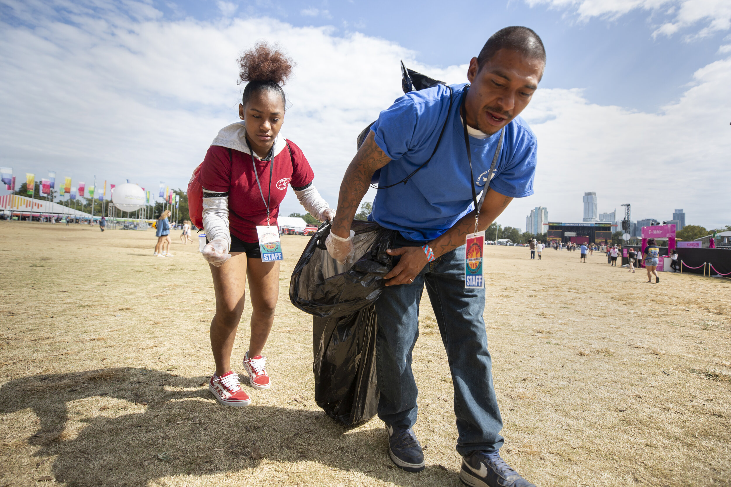  AUSTIN, TX. Princess Soliz (left) and Hector Olvera (right) clean up Zilker Park on Sunday morning as the last day of ACL Fest 2019 commences. They work for Chavez Cleaning Services and were hired to work at the festival. 