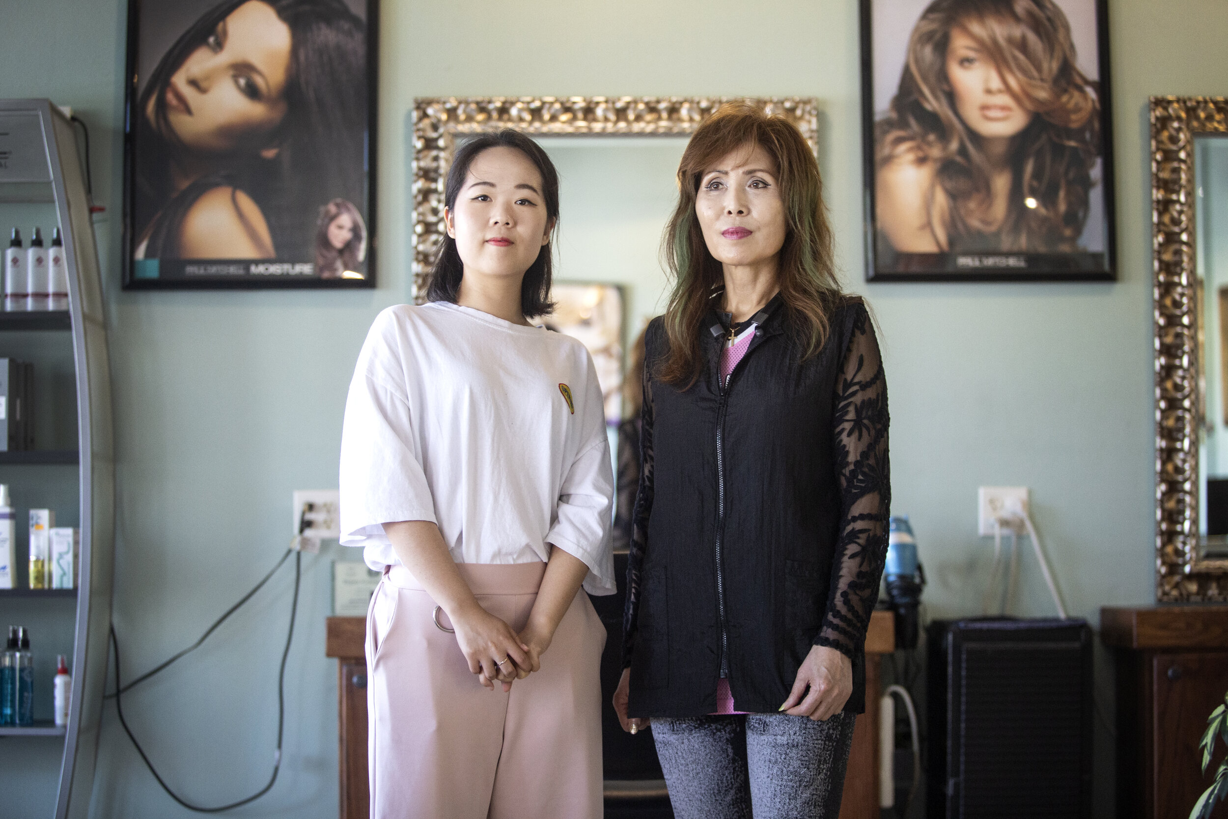  AUSTIN, TX. Sarah Kim (right), owner of Scissors Sound Hair Salon, keeps her business open for now, but is uncertain about the future as the coronavirus pandemic continues to worsen. Hair appointments have tapered off since January and have now almo