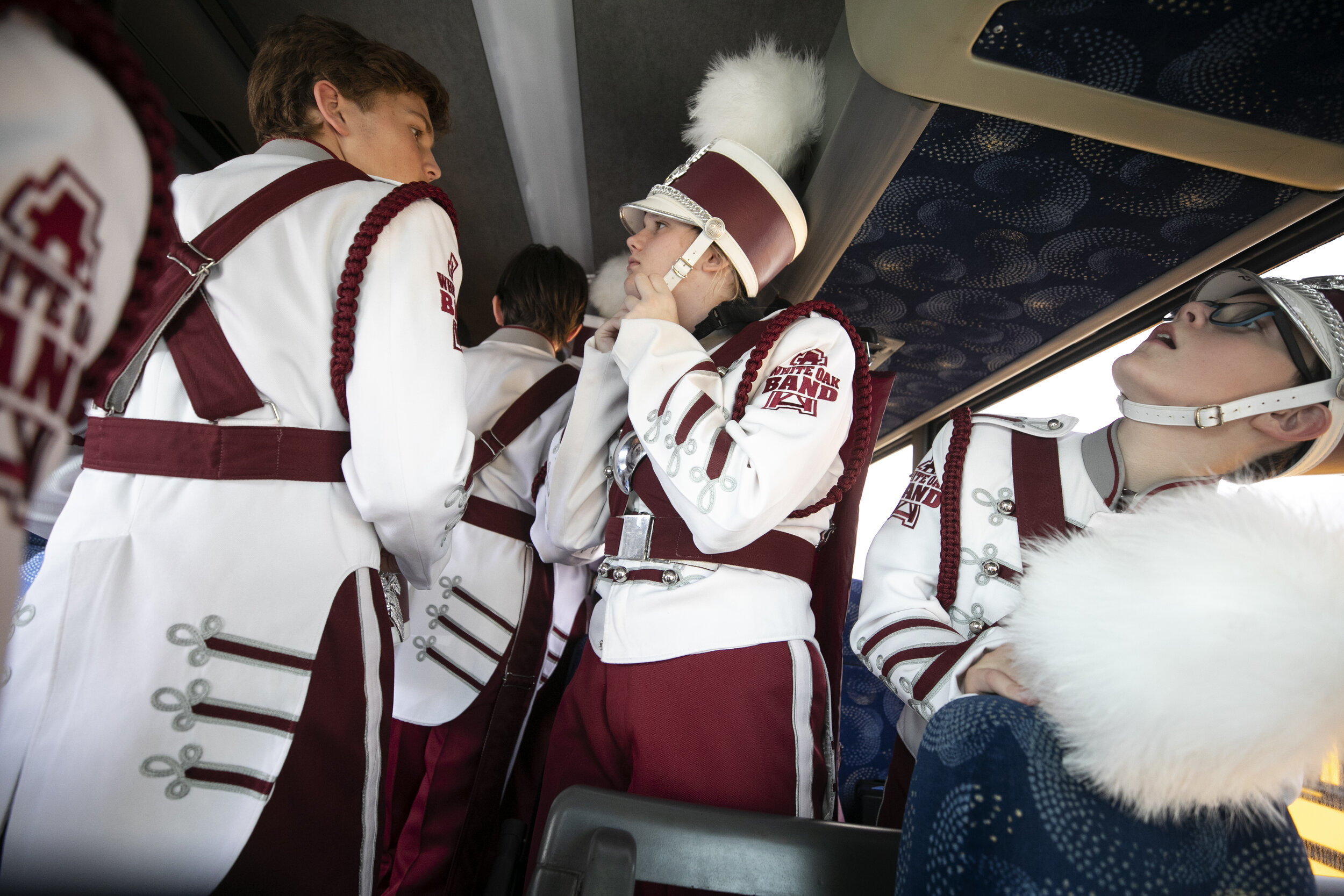  Students from White Oak High School prepare their uniforms on the school bus before entering the Alamodome for the UIL State Marching Band Competition. For many of the students from the small East Texas school, it was their first time traveling to a