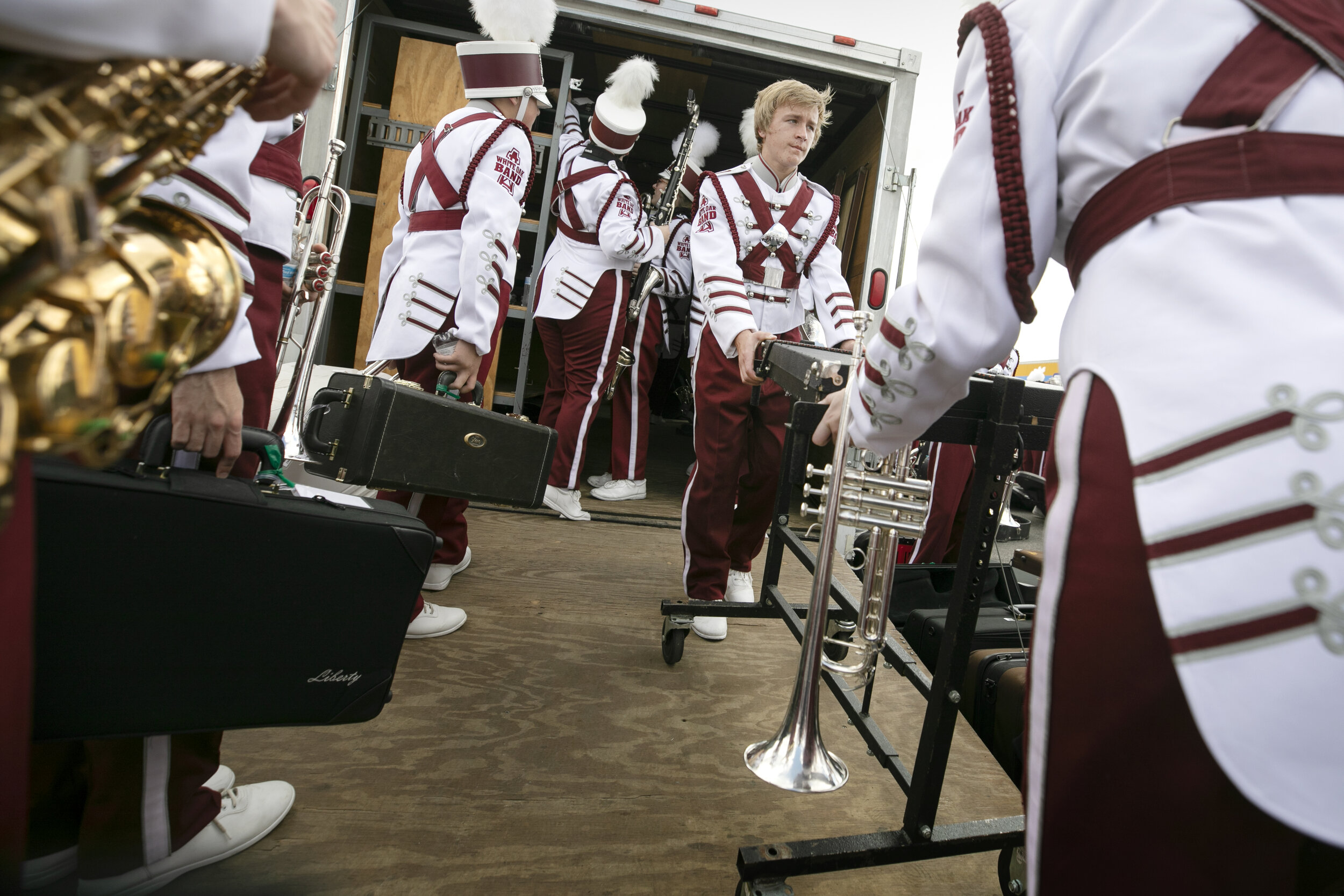  White Oak High School students unload their instruments before the UIL State Marching Band competition. 