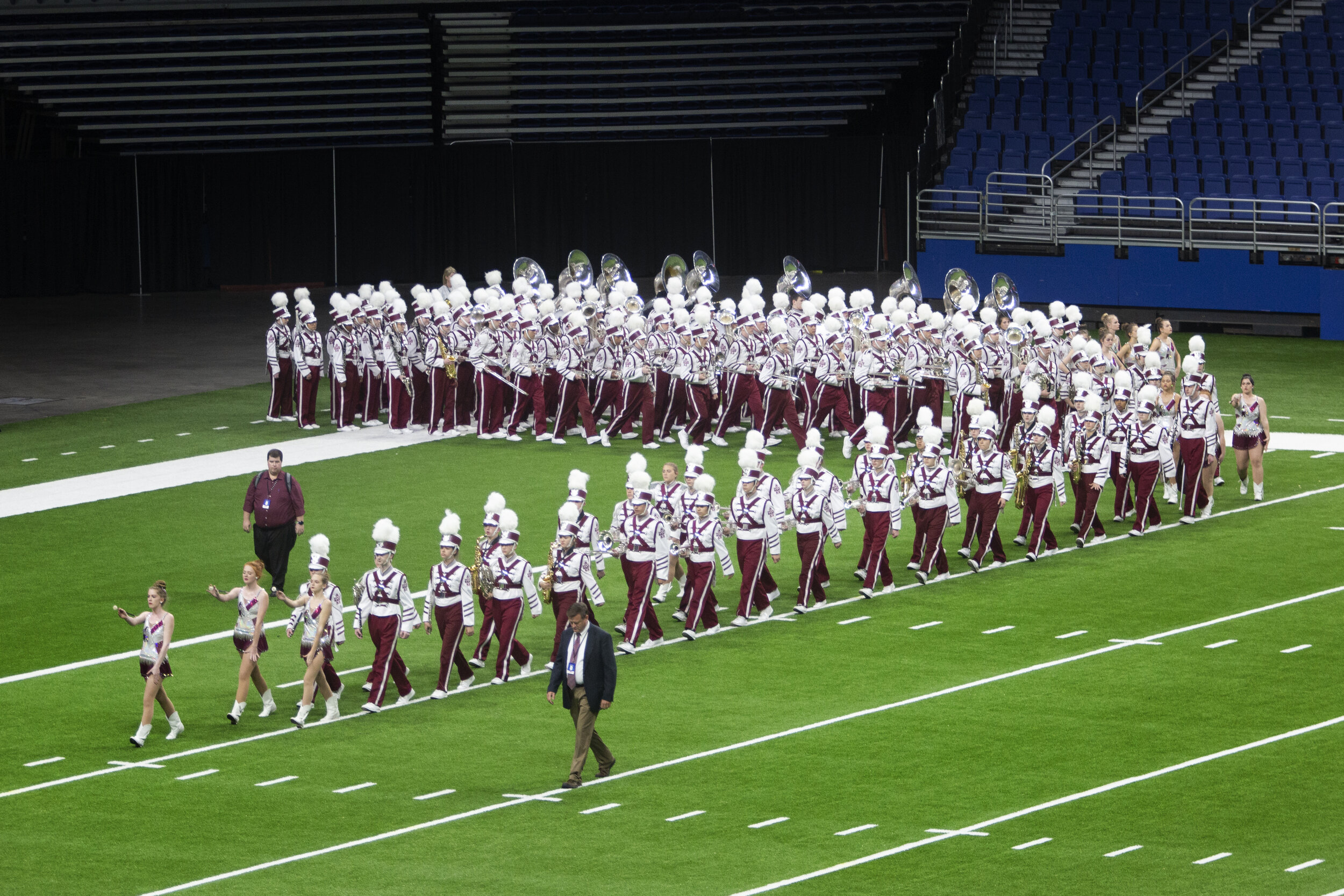  Band director Jason Steele leads White Oak students onto the field for their performance. 