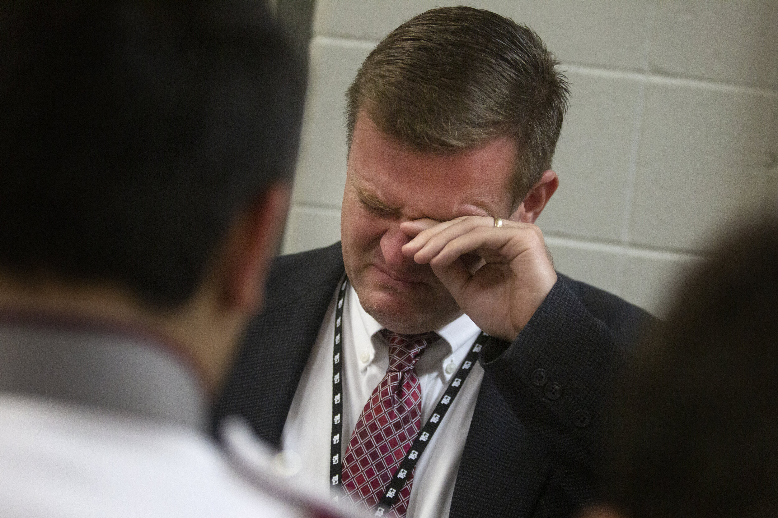  Band director Jason Steele cries during his pep talk, knowing that this will be the last time his military style marching band can compete in the UIL State Marching Band competition. 