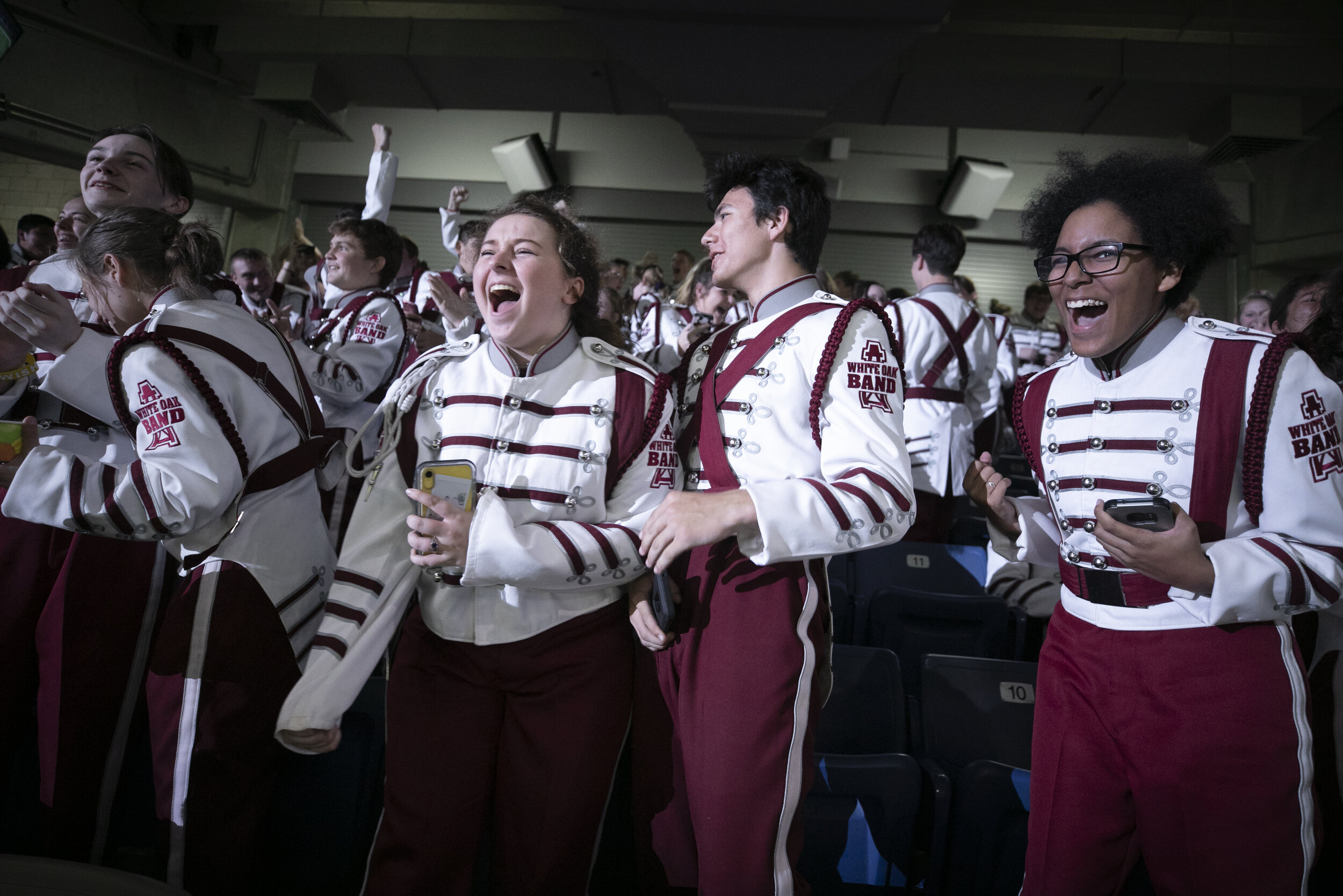  Students from White Oak HS cheer when their marching band makes finals at the UIL State Marching Band competition. 