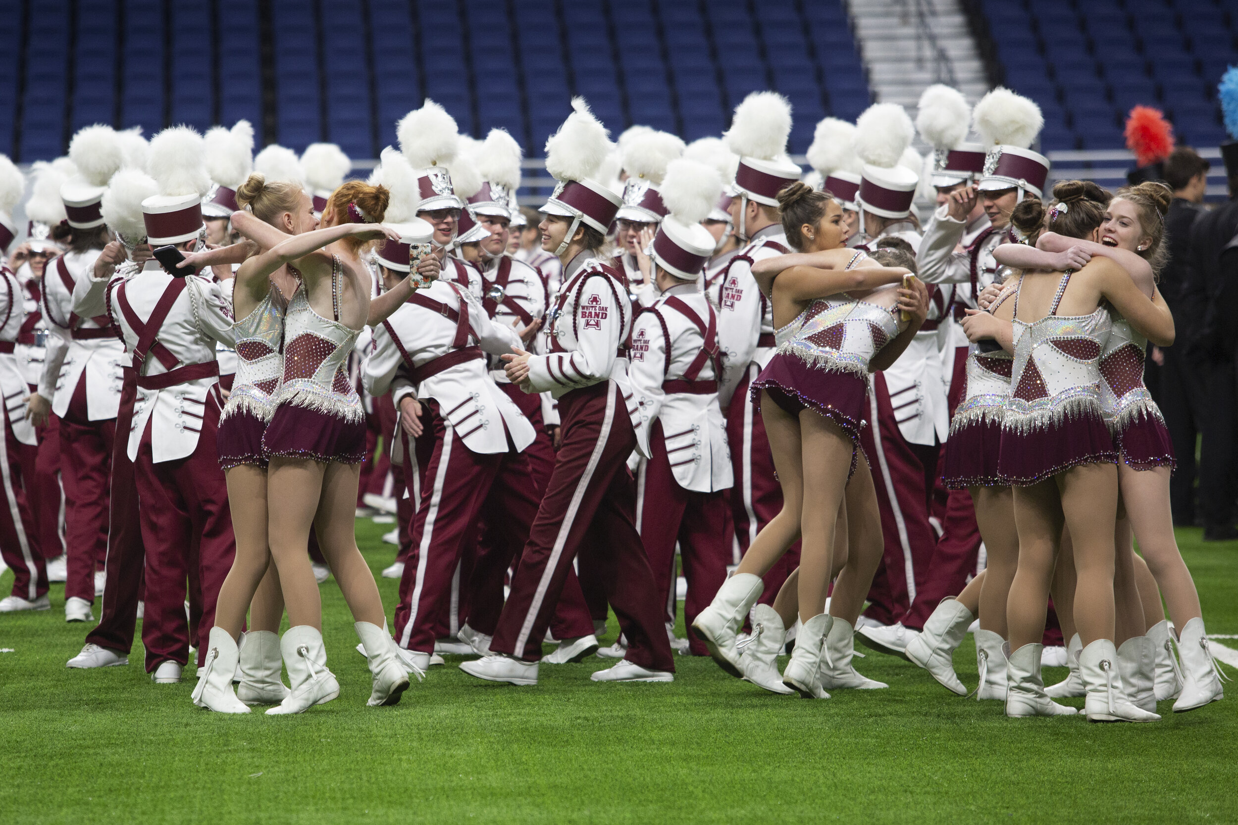  White Oak HS students celebrate taking fourth place at the UIL State Marching Band competition, despite the odds stacked against them as the only military style marching band in the competition.  