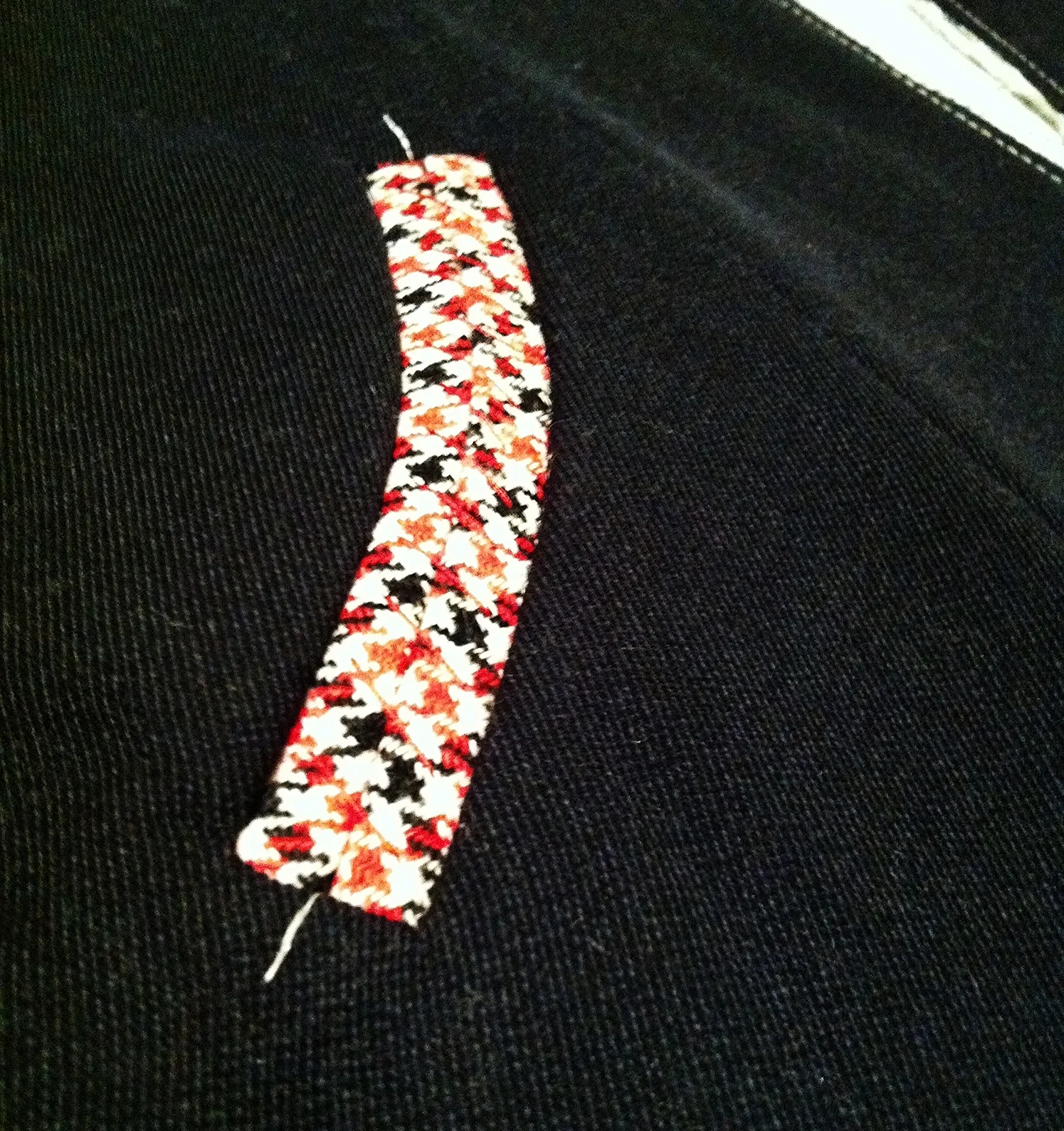Close up of the curved welt pocket detail. 