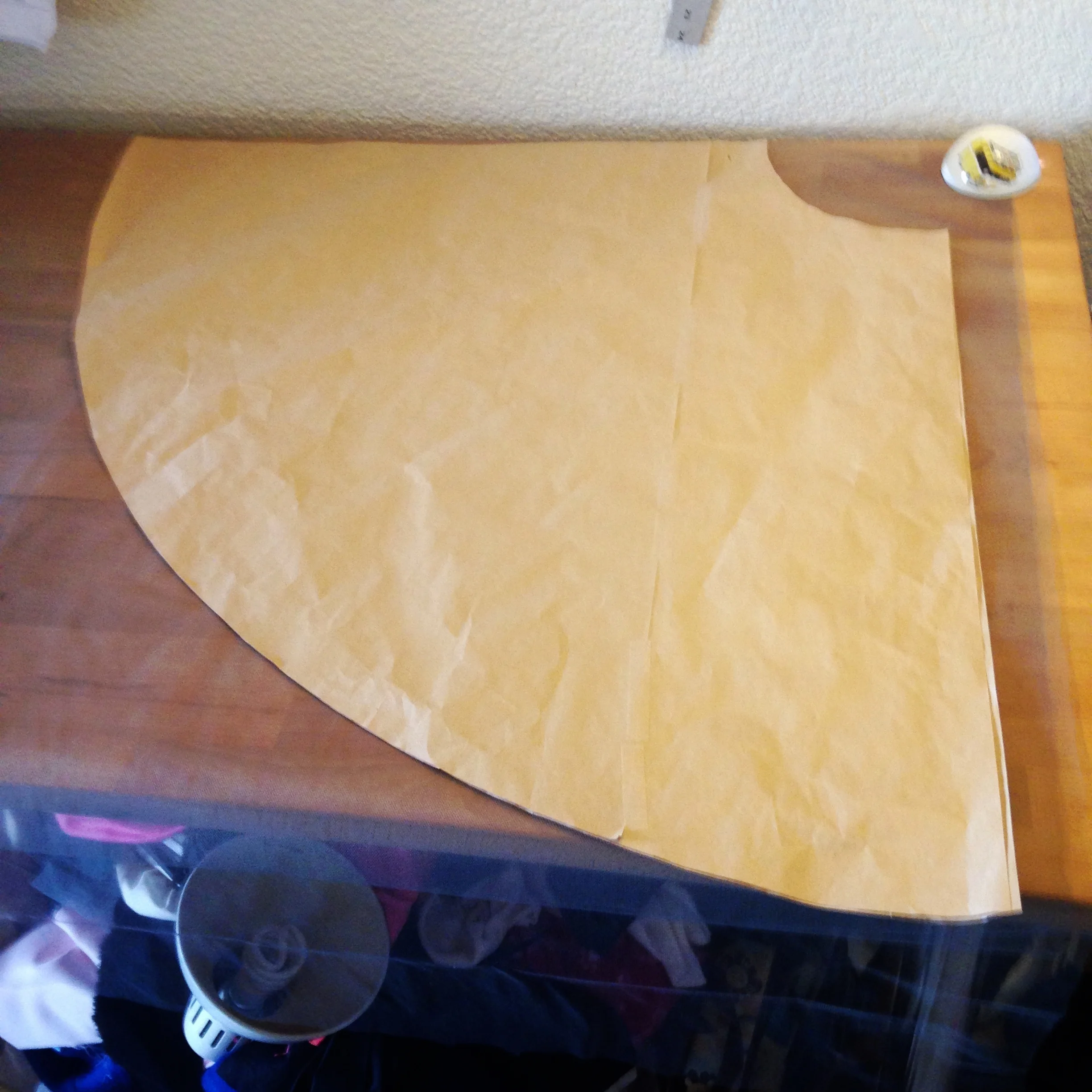 1/4 of my circle skirt pattern with layers of tulle stacked underneath it. 