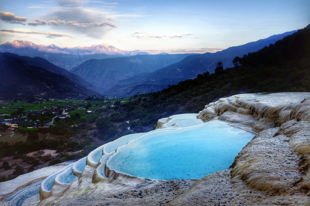The White Water Terraces of Baishuitai at dusk.