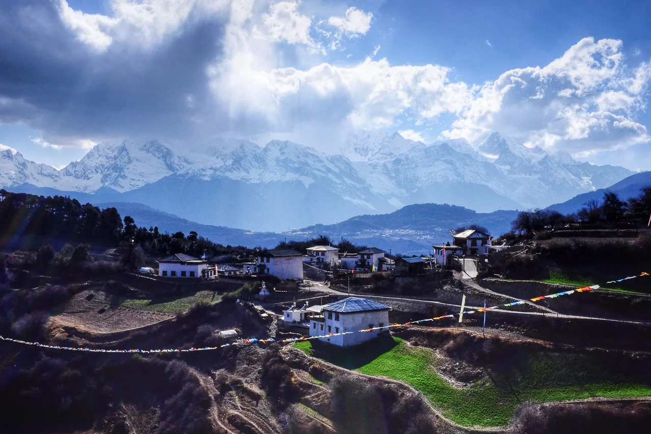Mt. Kawagarbo looming over a village on the outskirts of Deqin.
