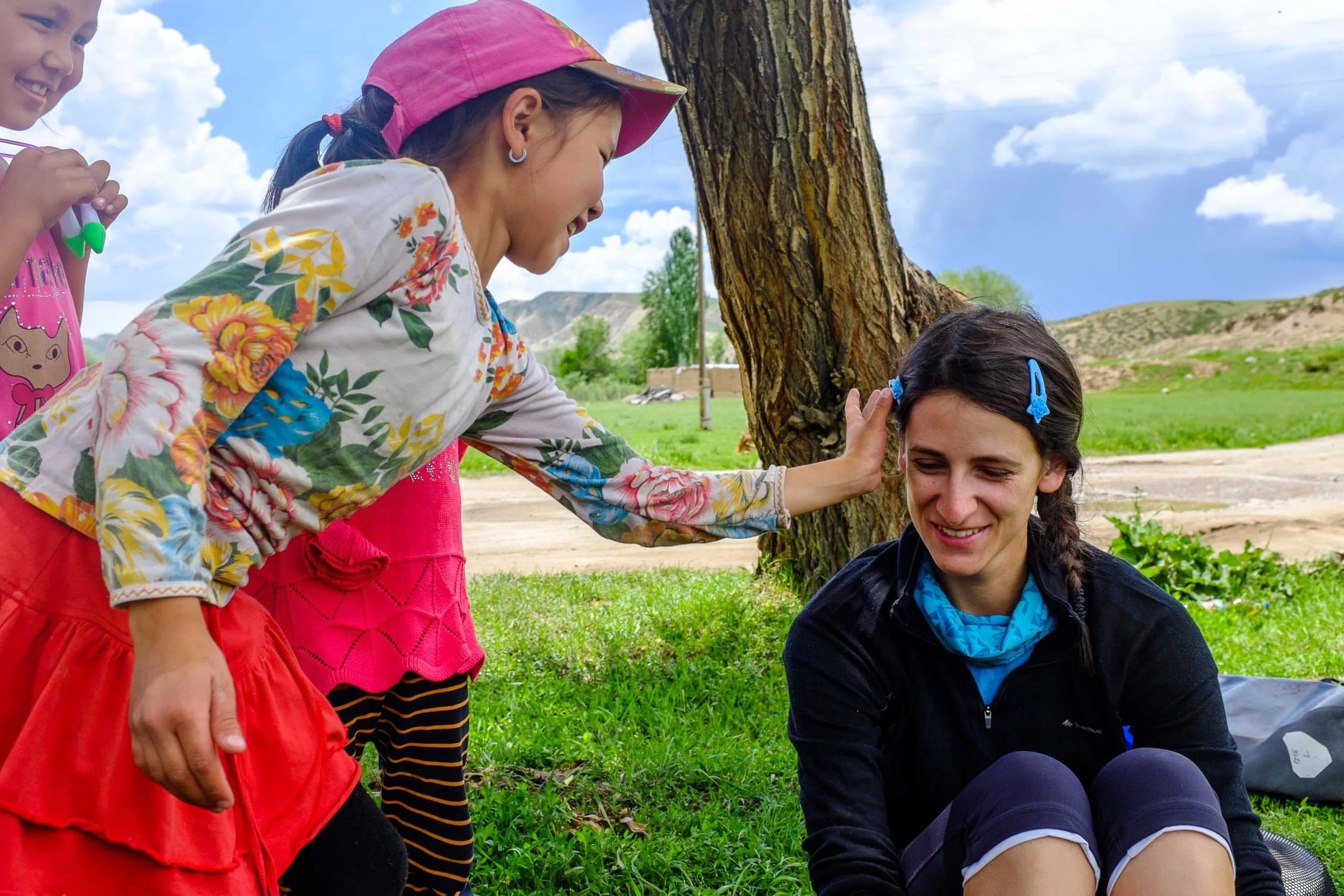 A local girl fixing Erica's hair