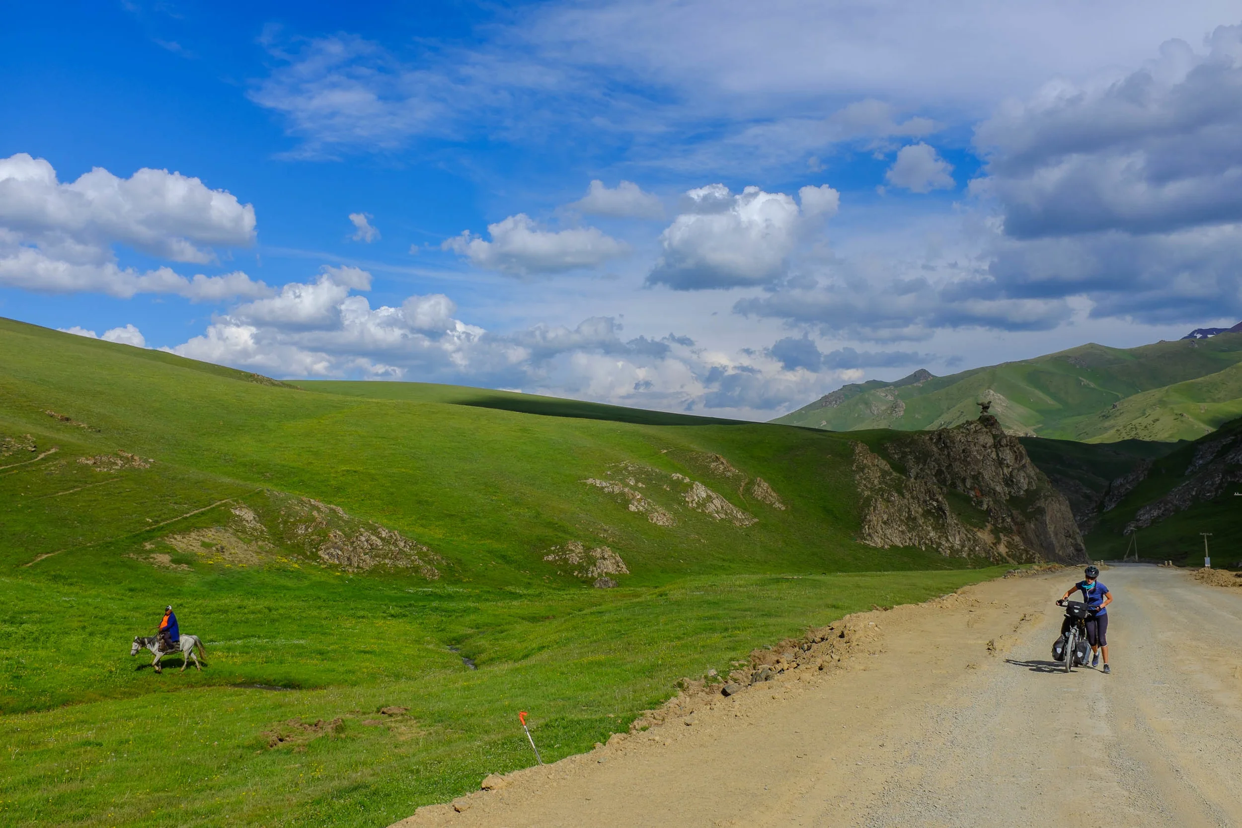 Horses seem to be a more efficient mode of transport than bikes on the Dollon Pass