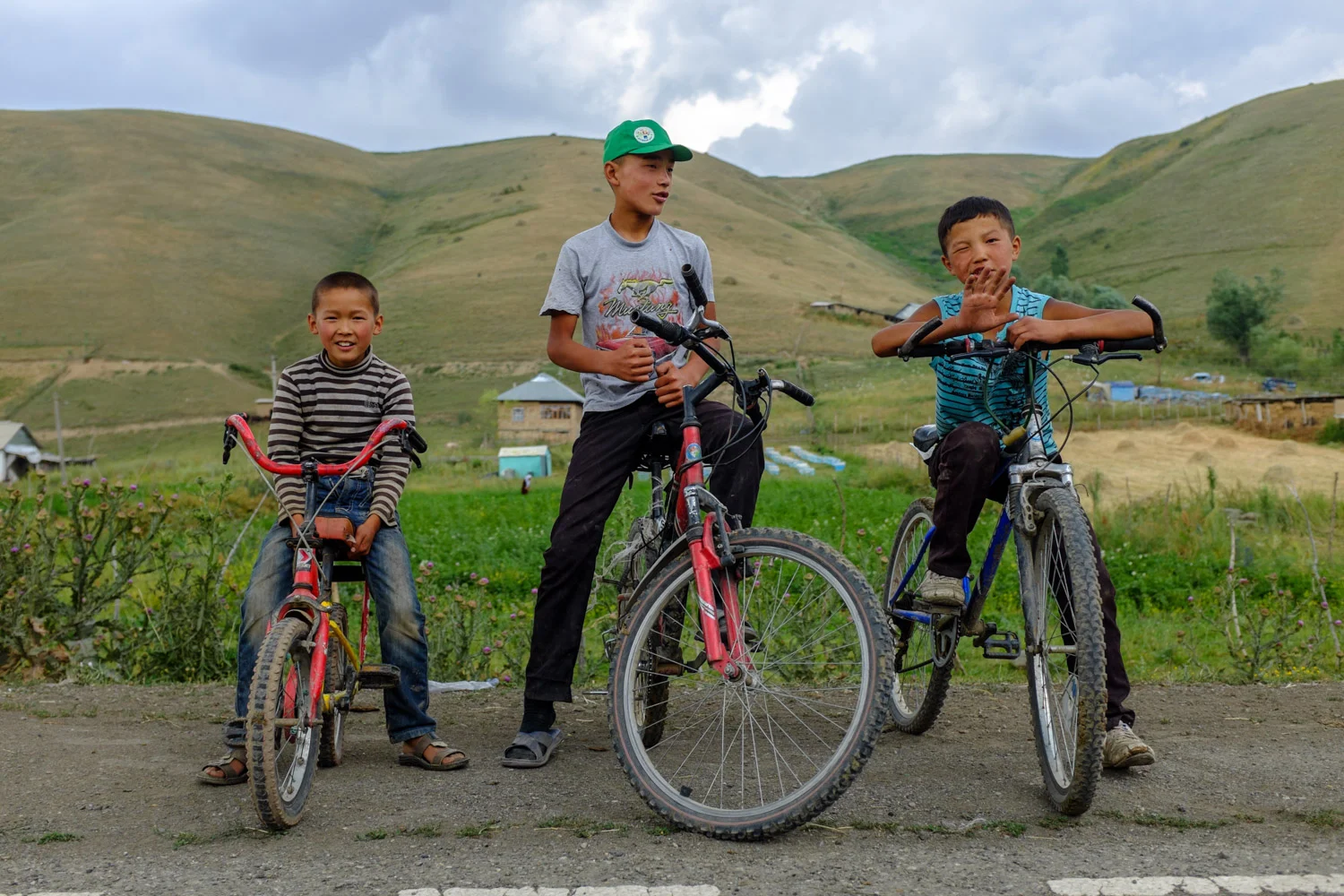 Kyrgyz boys and their bikes in a village outside Osh