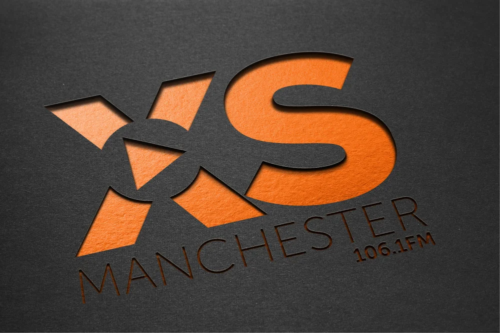 XS-manchester-logo-on-black.jpg