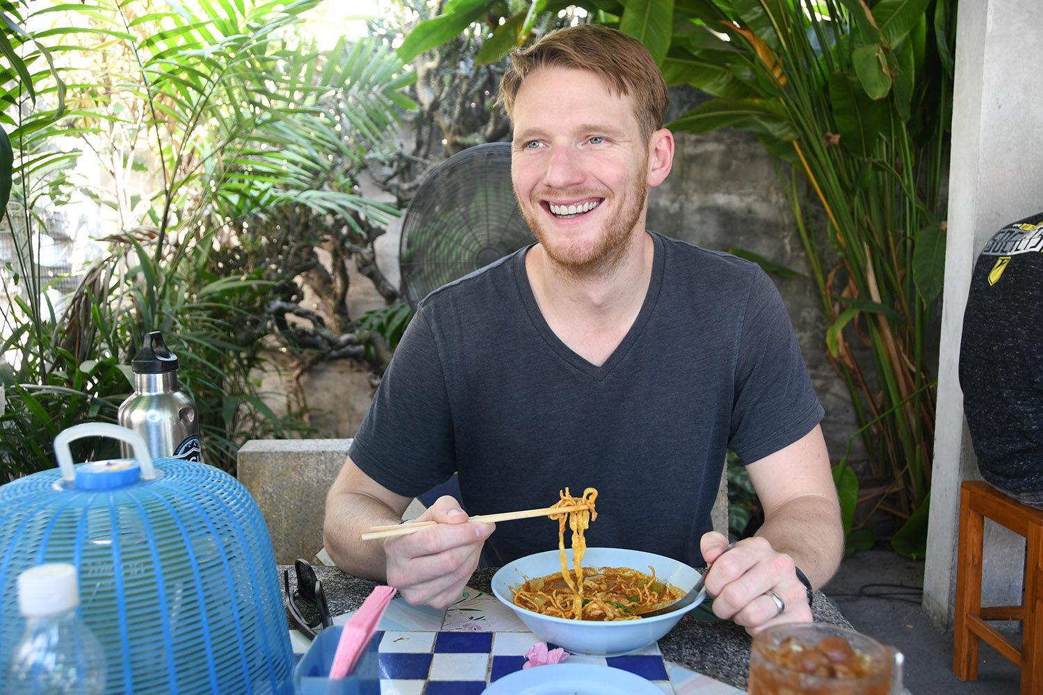 Trying the dish at the famous Khao Soi Khun Yai
