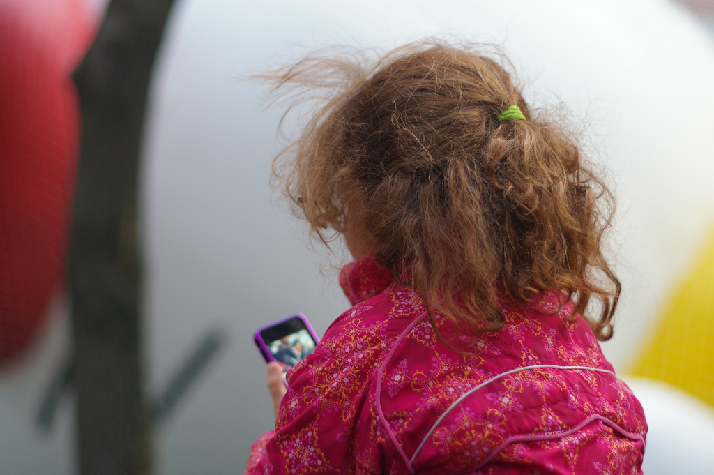 Children with iPhones at school.