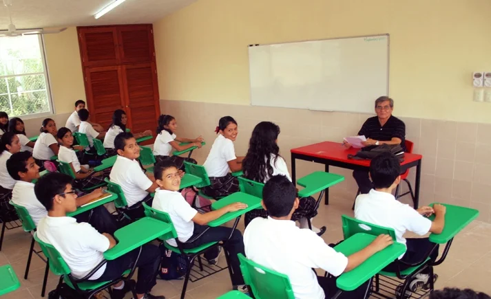 Students at school taking an exam