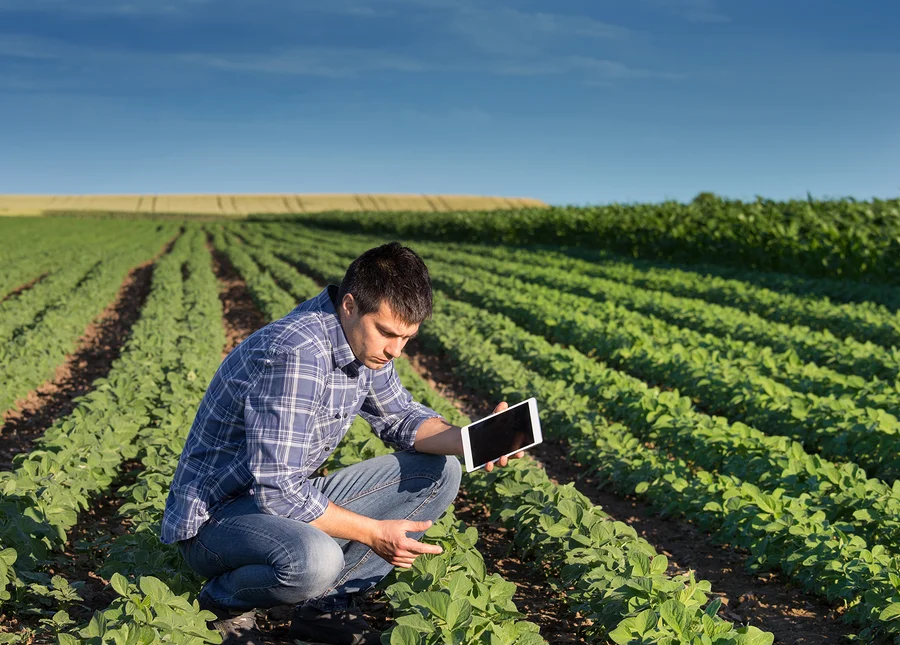 man using ai technology on a field