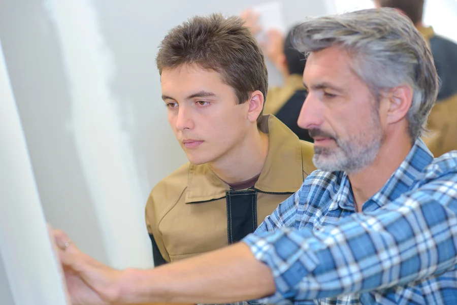 Middle school student and employer working together