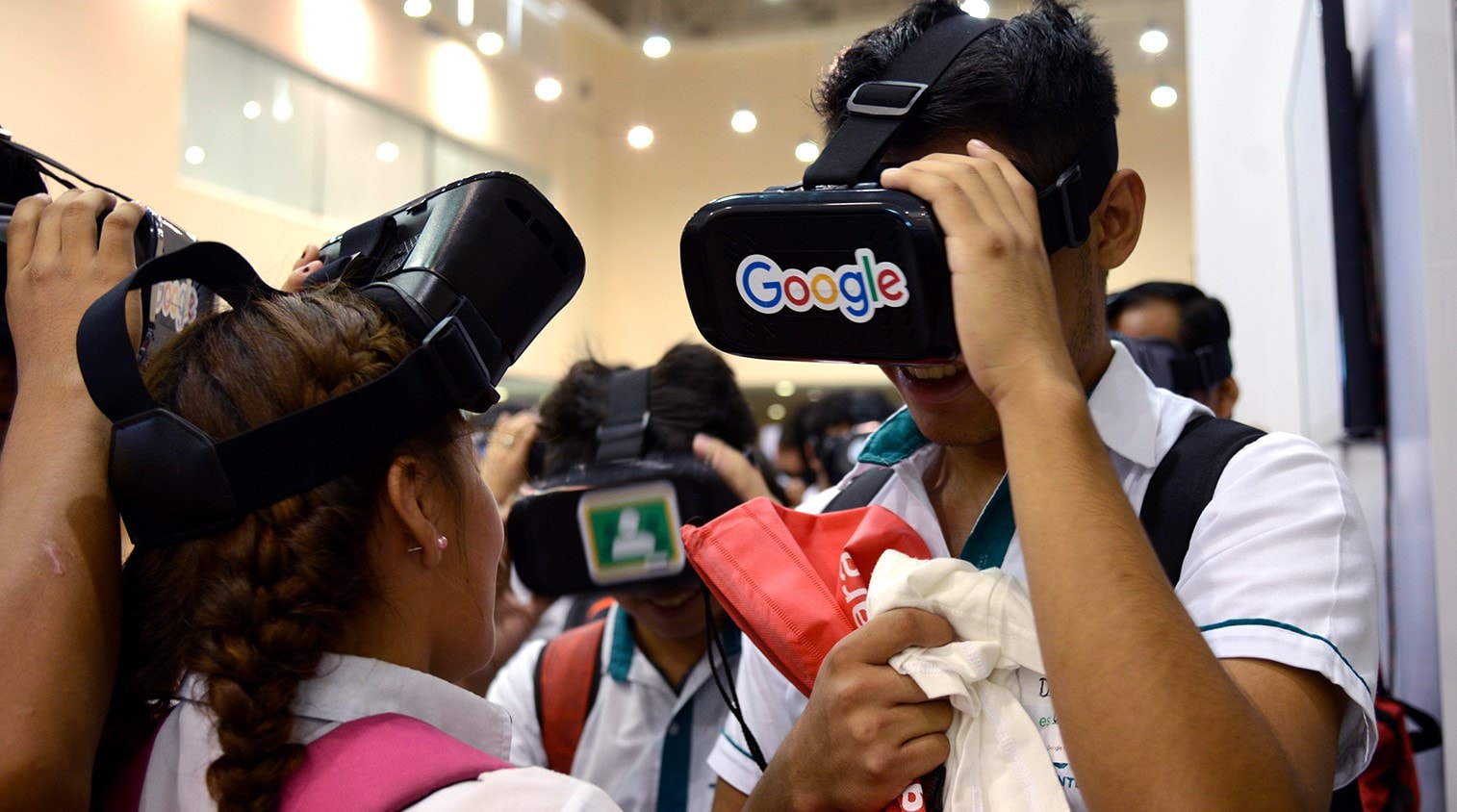 Kids using Google VR headsets