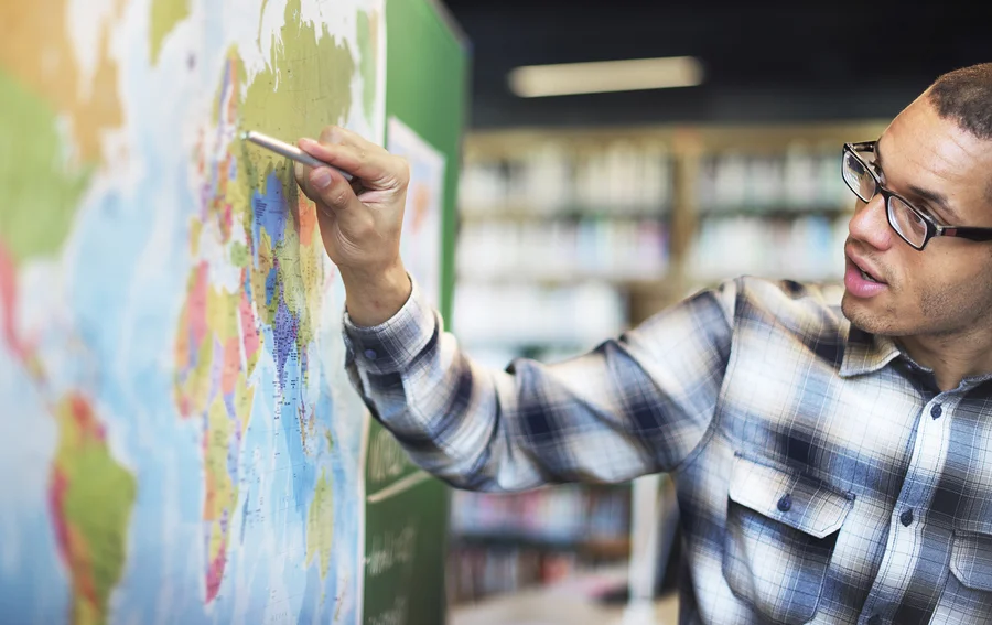 bigstock-Teacher-Teach-Teaching-Geograp-124988603.jpg