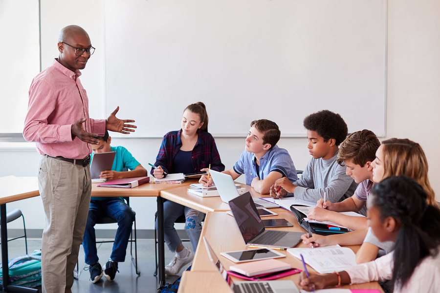 bigstock-High-School-Teacher-Talking-To-248027032.jpg