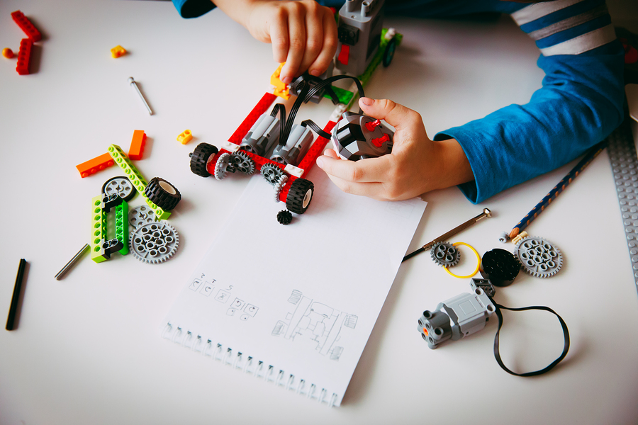 bigstock-Little-Boy-Building-Robot-At-R-227697319.jpg