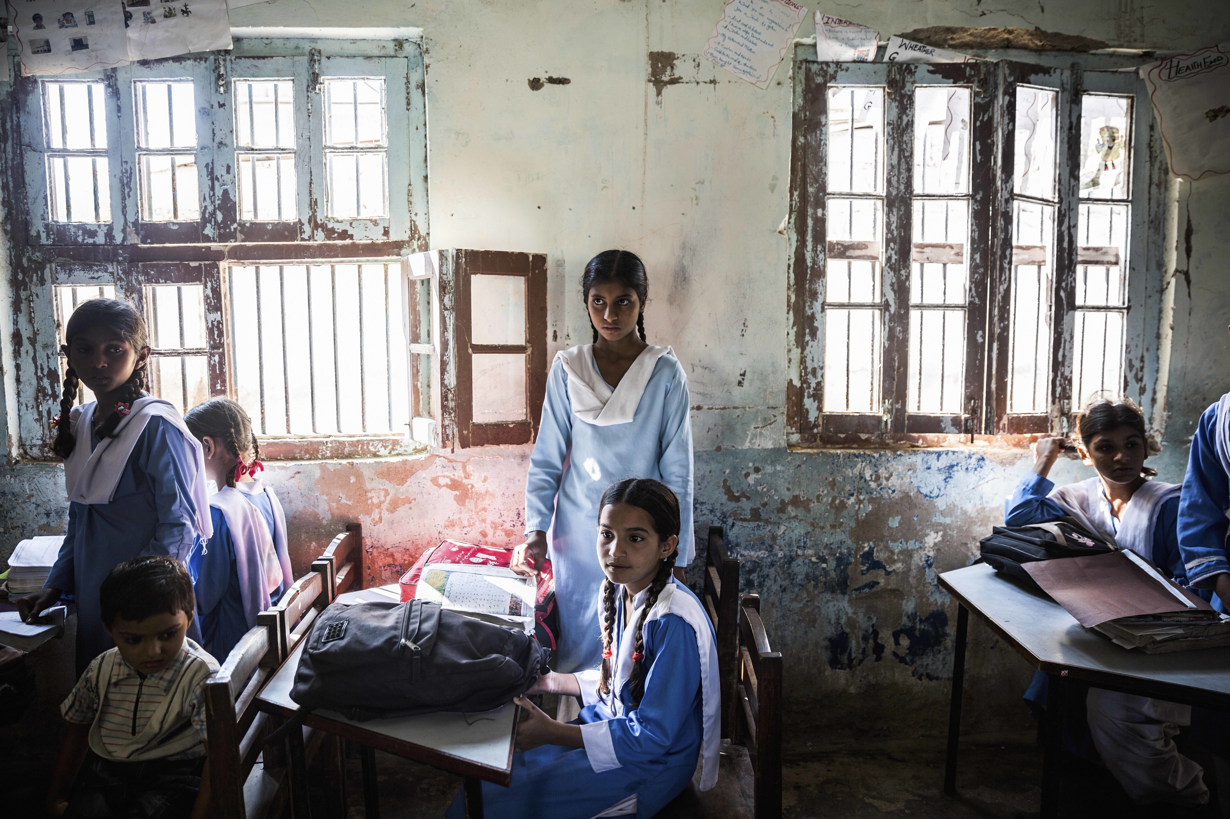 Pupils await the start of lessons at the Government Girls Primary School in Chaudhry Atta Muhammad. Since the sanitation block was built, attendance has increased, with parents reassured that their children will not have to leave the school compound to find a place to go to the toilet.