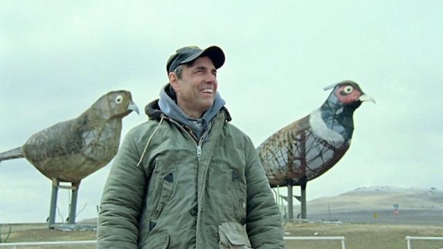 Gary Greff in front of "Pheasants on the Prairie". Which consists of a 40-foot tall rooster, a 35-foot tall hen and two chicks that reach 15 feet high. Weighing in together at a whopping 30,000 pounds.