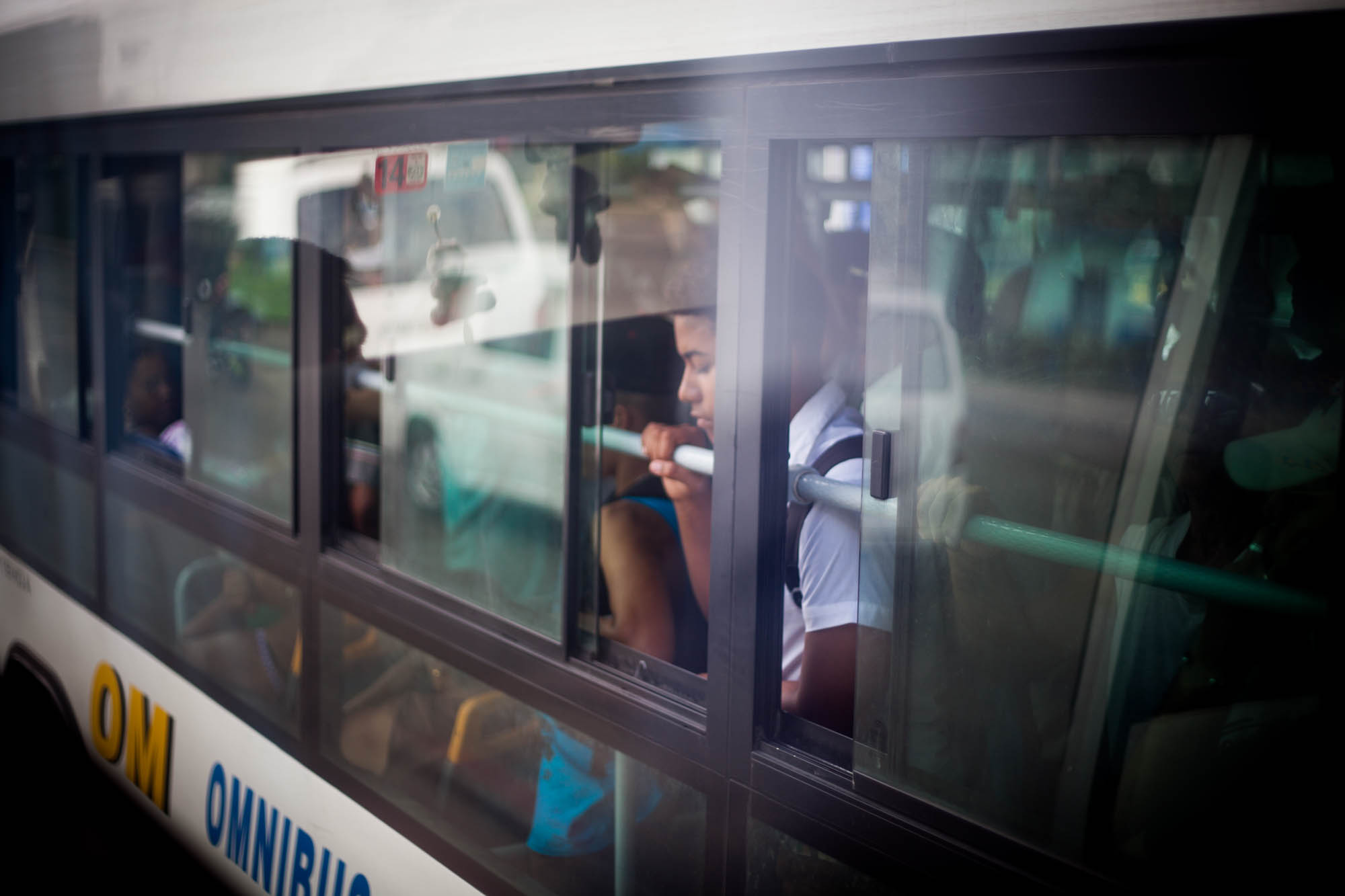 BUS RIDE REFLECTIONS While we were taking a cross-country bus, I noticed this youngster looking out one of the windows of a neighboring bus. 