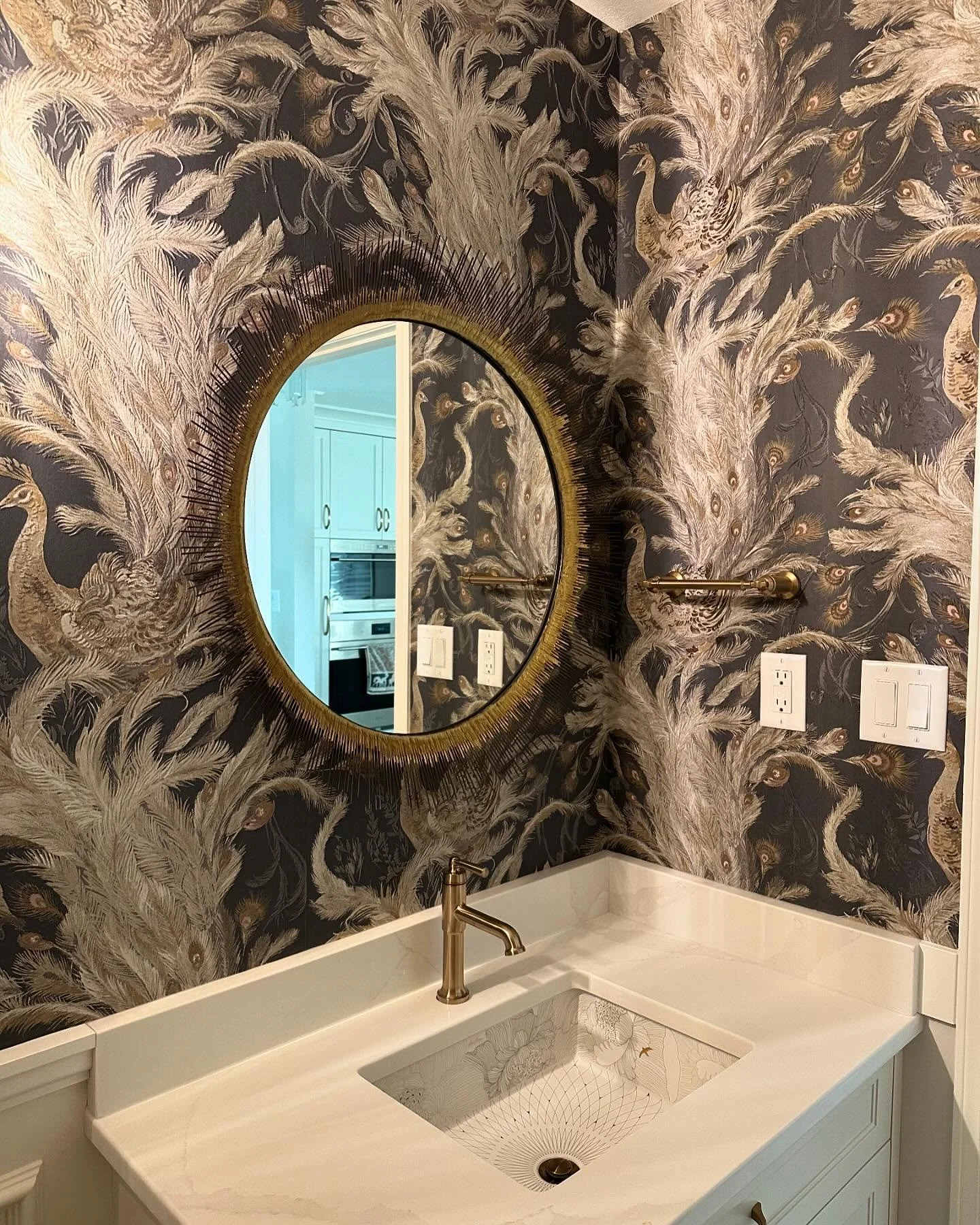 We finished off this dreamy powder room today ✨. The details in this room are so stunning, from the @kohler sink to the peacock wallpaper we love it all! 

For details on the finishes seen here including the wallpaper from @jffabrics send us a messag