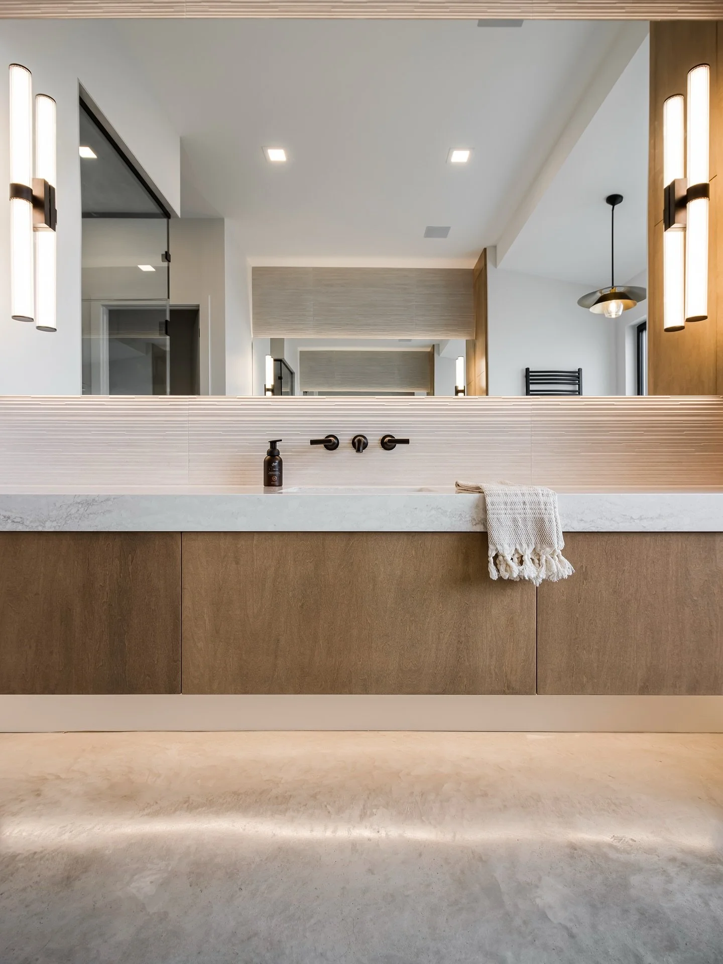 ✨ DESIGN TIP TUESDAY ✨ 

A floating vanity keeps sightlines open, adds modern edge, and makes smaller bathrooms feel larger. Paired with continuous flooring and a warm, neutral palette, the result is a seamless, calming design that feels both grounde