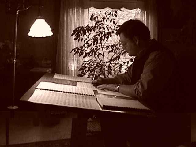 Daron Hagen copying the full score of his opera "Bandanna" in Milwaukee in winter, 1998. (Photo: Ryan Hagen)