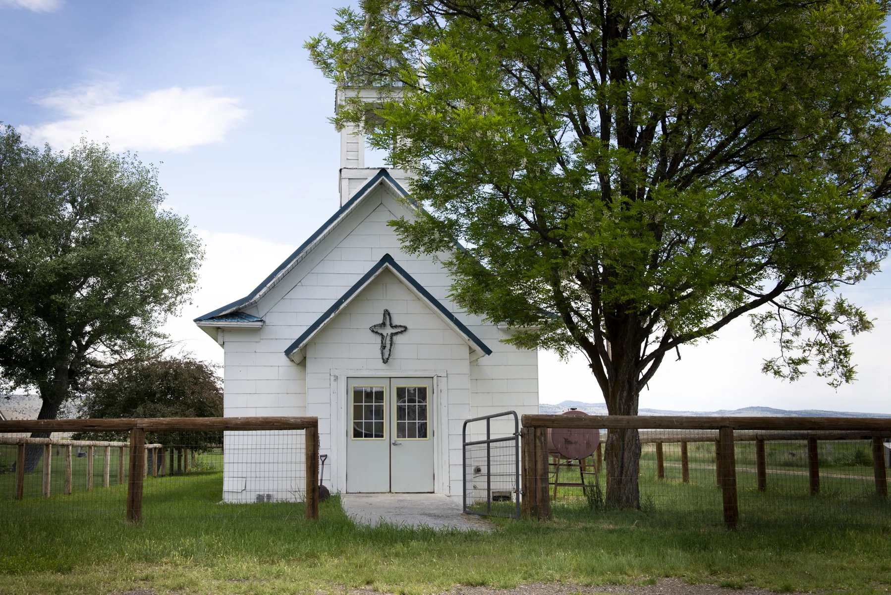 Cute little church with a strand of lights for a cross. I bet it looks awesome at night. 