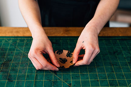 Megan finishing a mini leather print bowl in the Stitch &amp; Shutter Studio