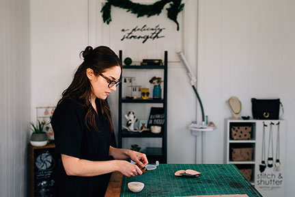 Megan wet molding and forming a leather bowl in the Stitch &amp; Shutter Studio 