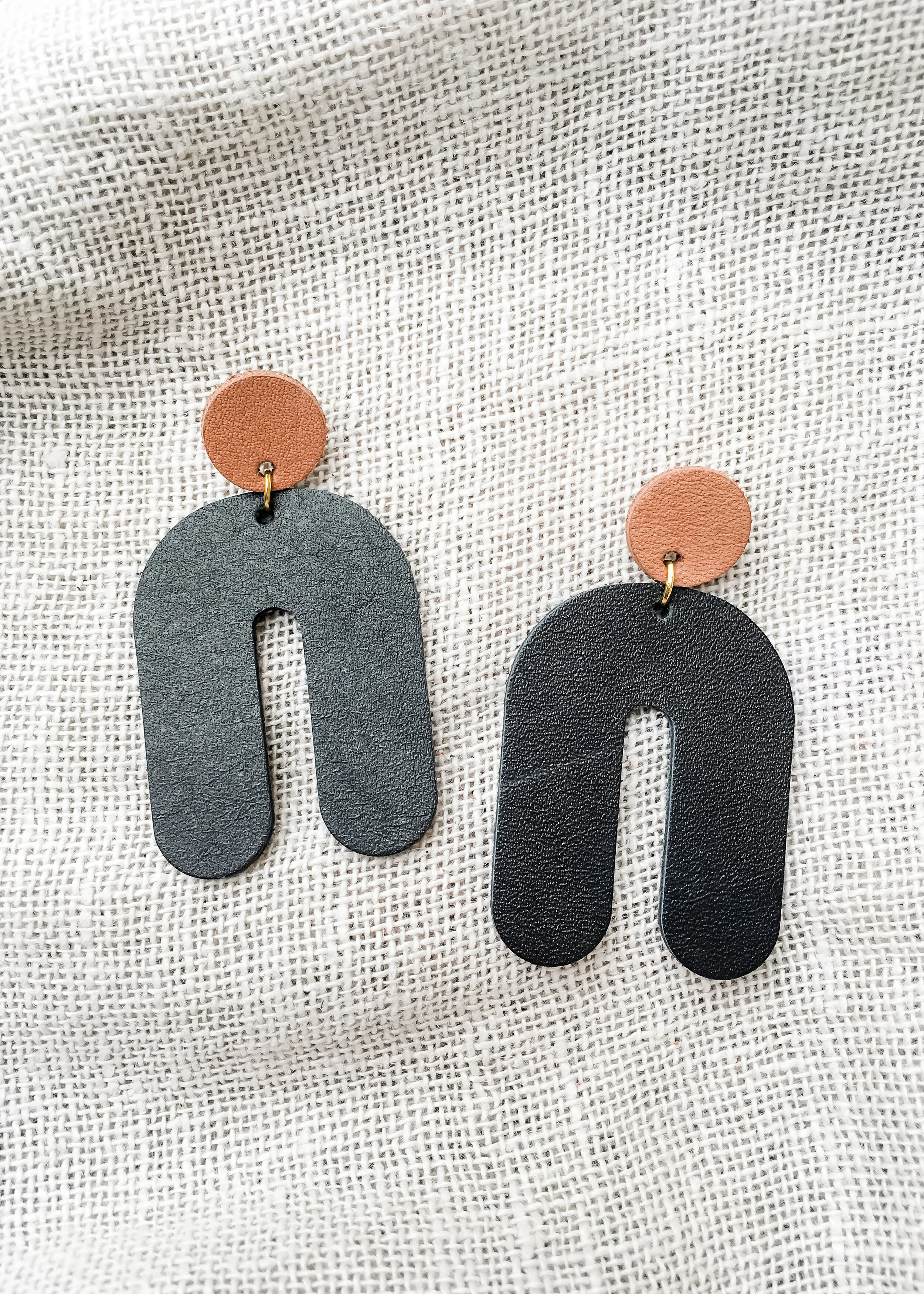 arch drop earrings tan black