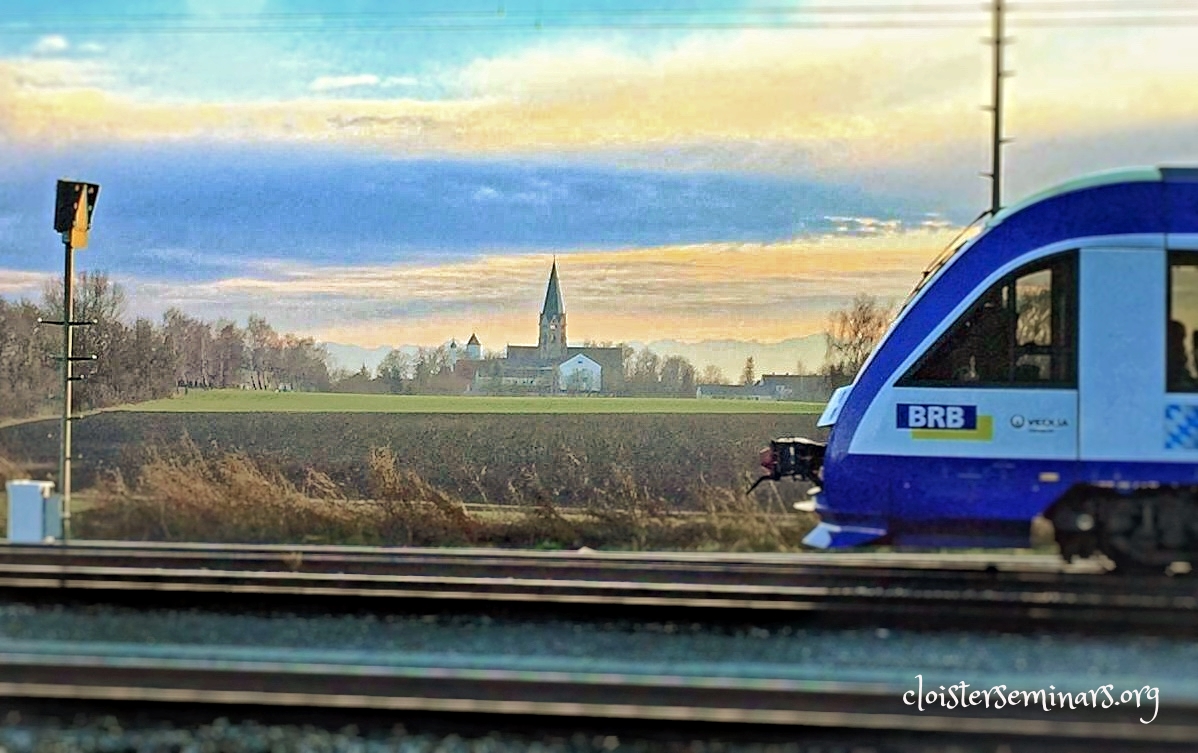 View from the train tracks to St. Ottilien. The blue you can see behind the abbey, even with the top of the trees, is the Alps in the distance.