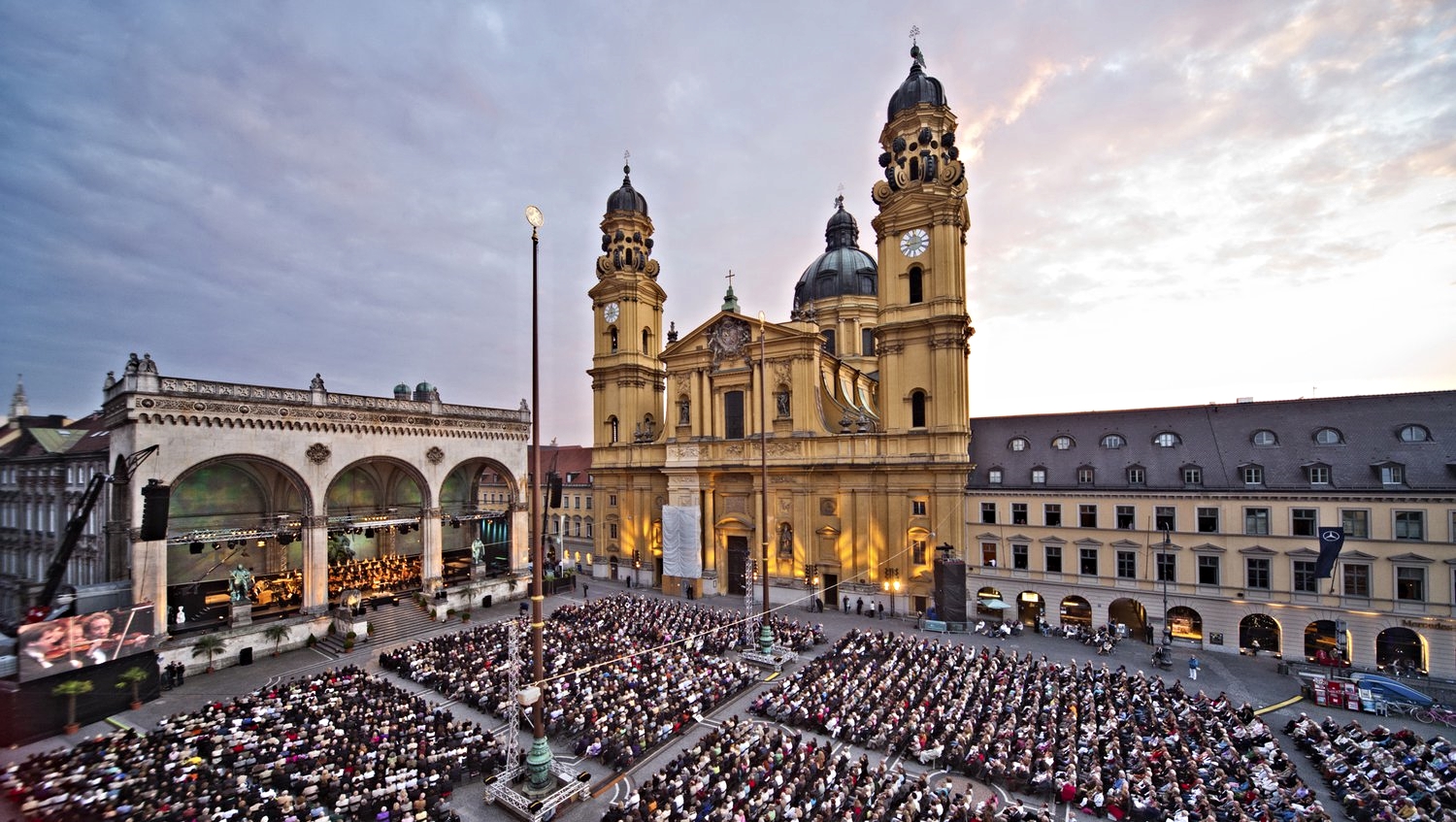 Where time is thin: Munich's Odeonsplatz with the Feldherrnhalle (left) and the Theatiner Kirche. The square is a spot for cultural activities today (like this concert). In 1923 it was famous as the place where Hitler's mob marched before he was arrested. The monument with the arches was built in 1844 by King Ludvig of Bavaria to honor his Generals. The church was built in 1690, but not finished until 100 years later. The whole complex is situated at what was once the north gate in Munich's city wall, built in 1391. The city first appears in written records in the 1150s, but there were Benedictine monks on the site as early as the 700s. The Romans built in cities all around, but ignored this spot, where there has been a settlement since around 4,000 BC. 