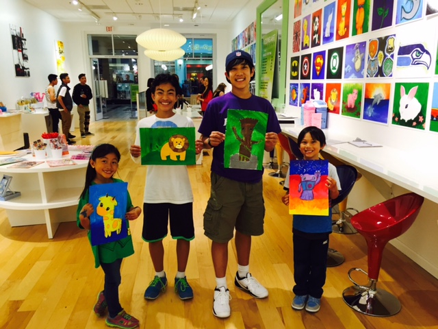 Student holding their artwork.