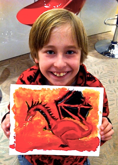 Student holding their artwork.
